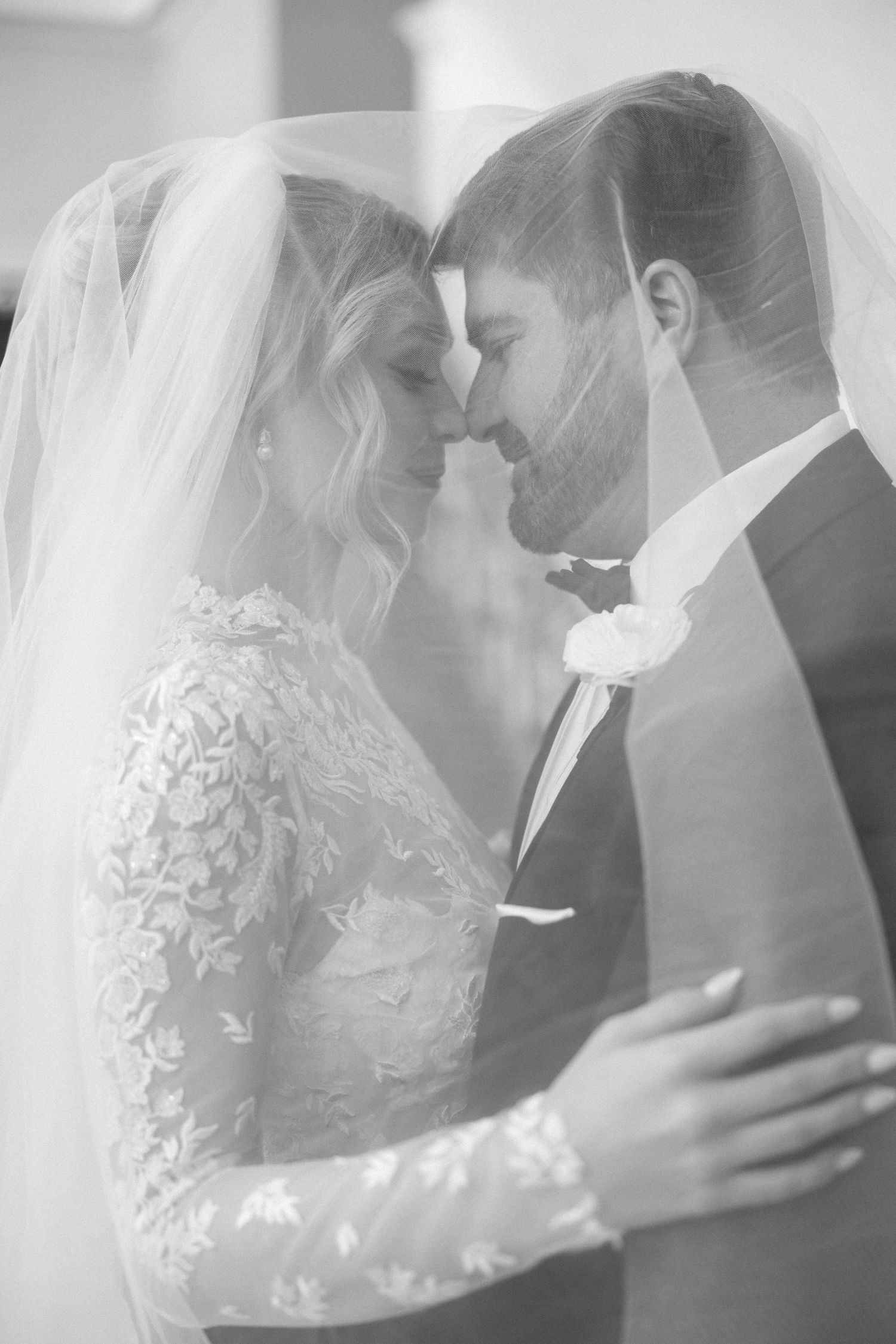 Soft-focus wedding portraits showing intimate moments between newlyweds.