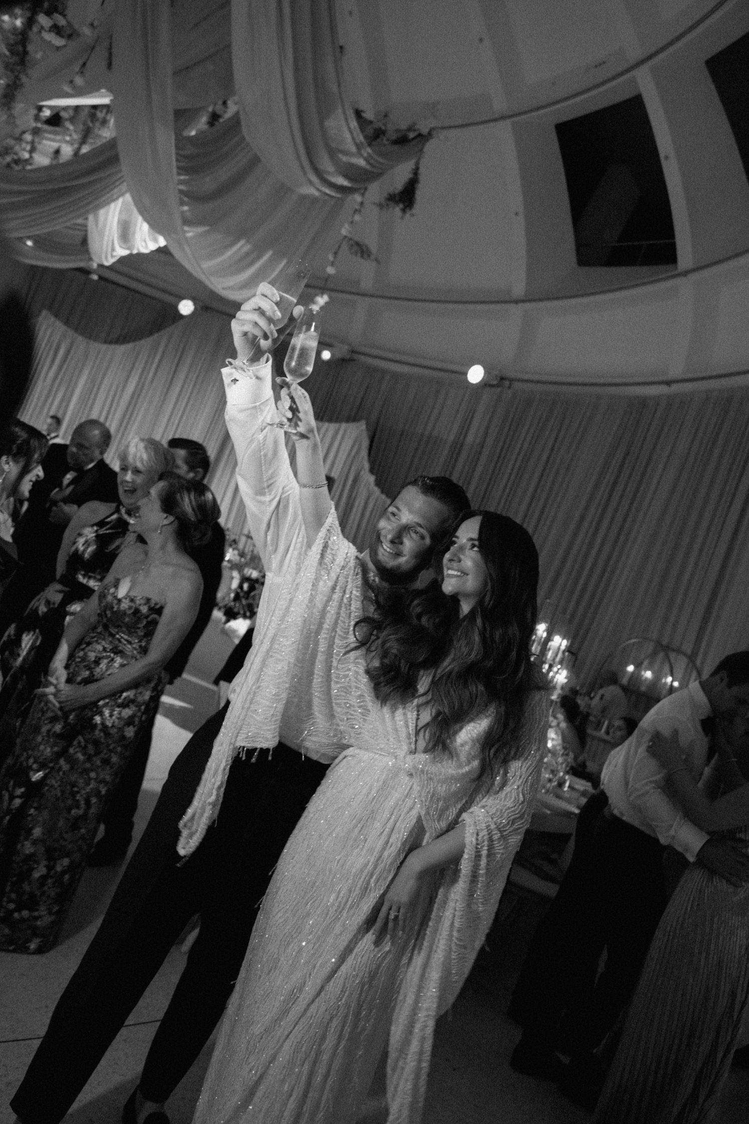 Wedding celebration with guests dancing and enjoying the festivities.