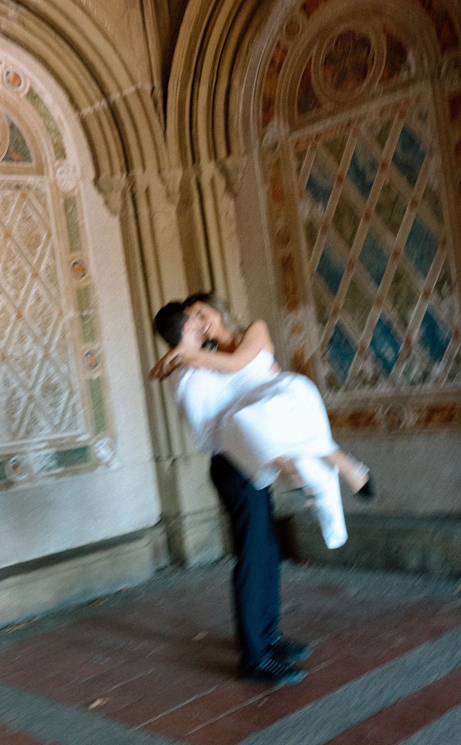 Artistic sequence showing dancing couple in an ornate archway with decorative ceiling.