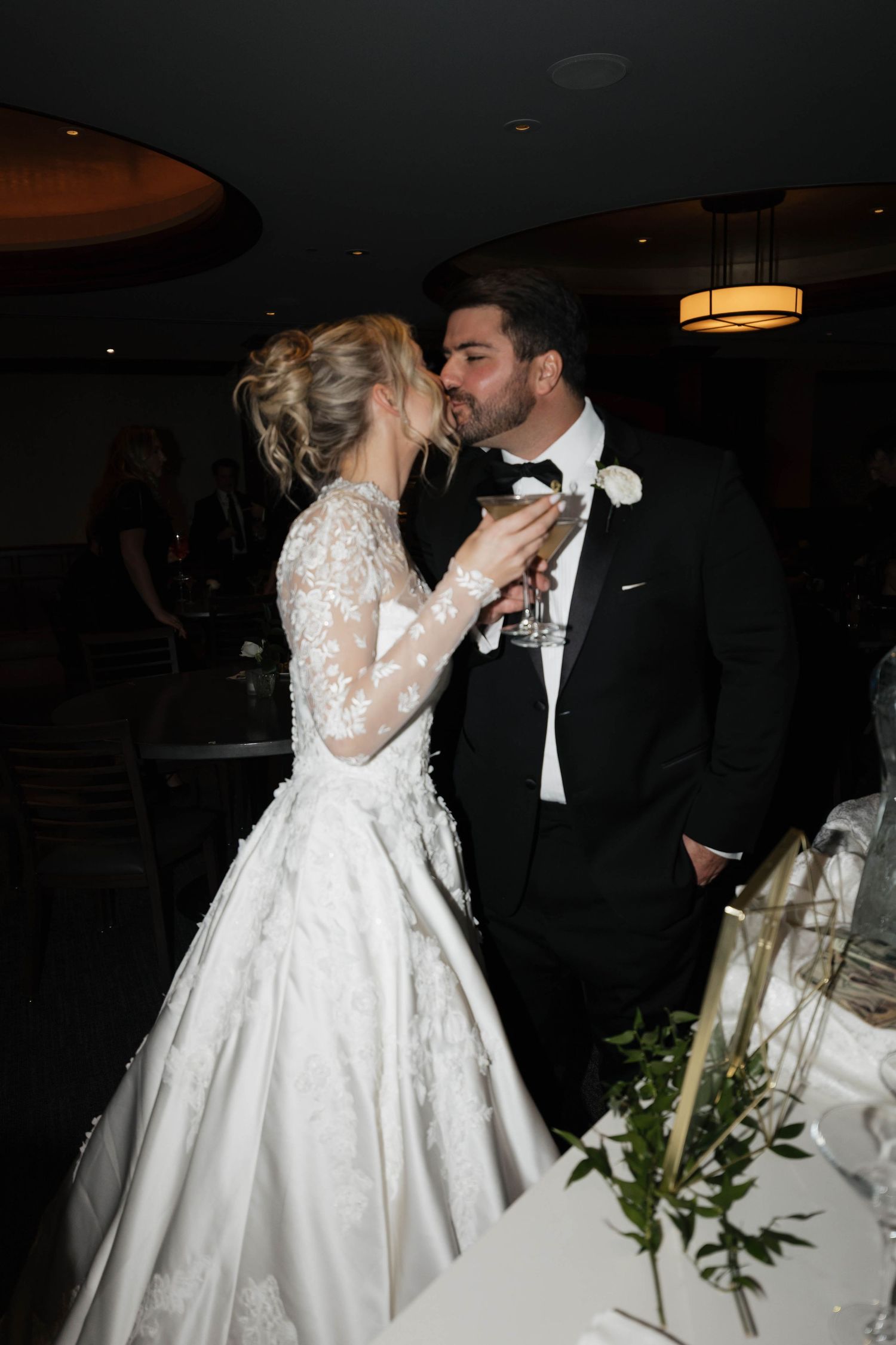 Formal wedding reception scene with elegant decor and ambient lighting.
