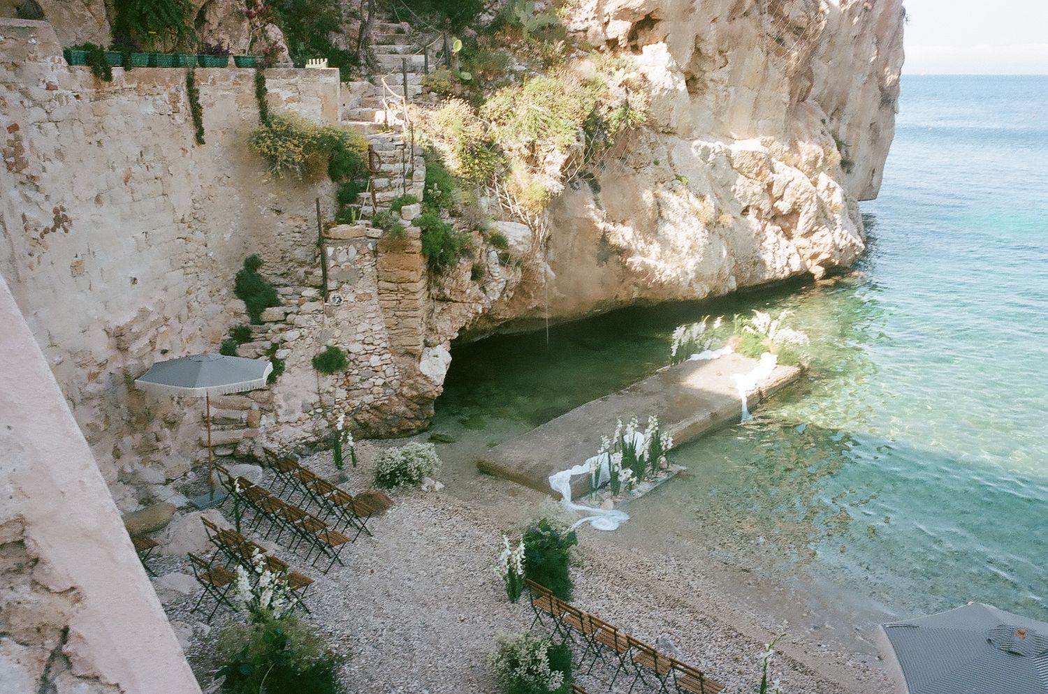 Scenic limestone cliffs and turquoise waters along the Adriatic coast in Puglia, Italy create a stunning natural seascape.