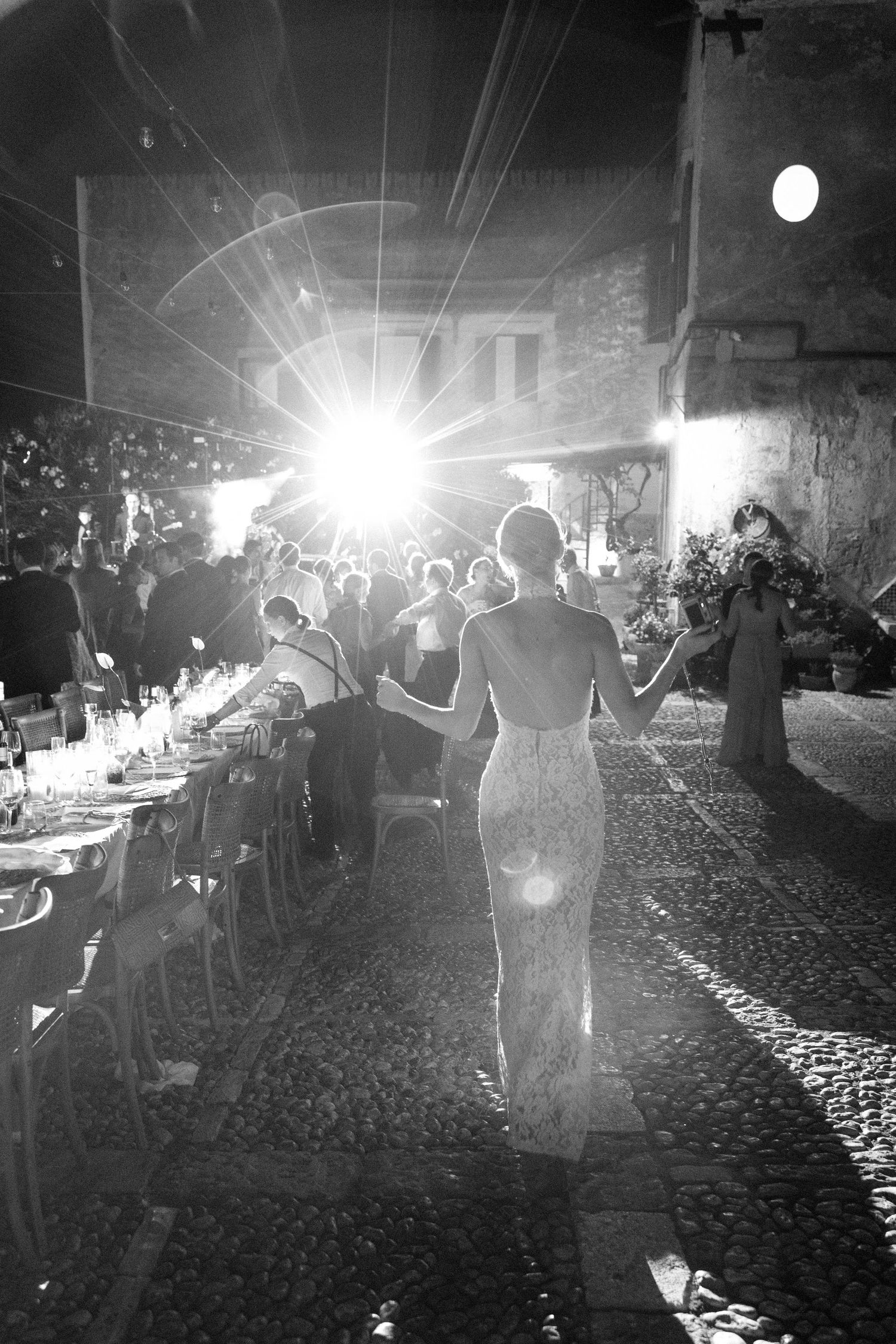 Wedding reception party scene with dramatic lighting and sparklers.