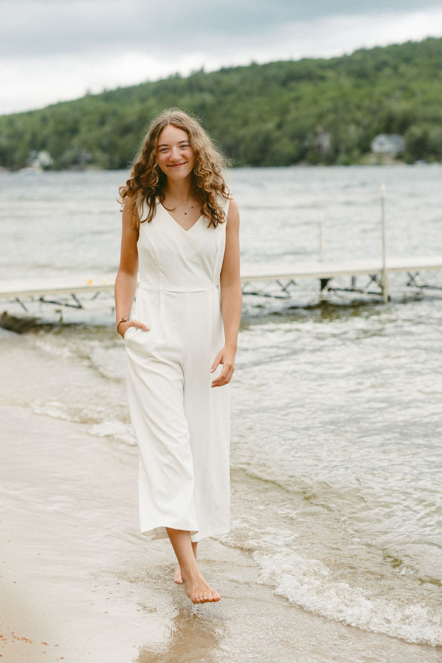 Series of beach photos showing someone in a white dress walking along the shoreline.