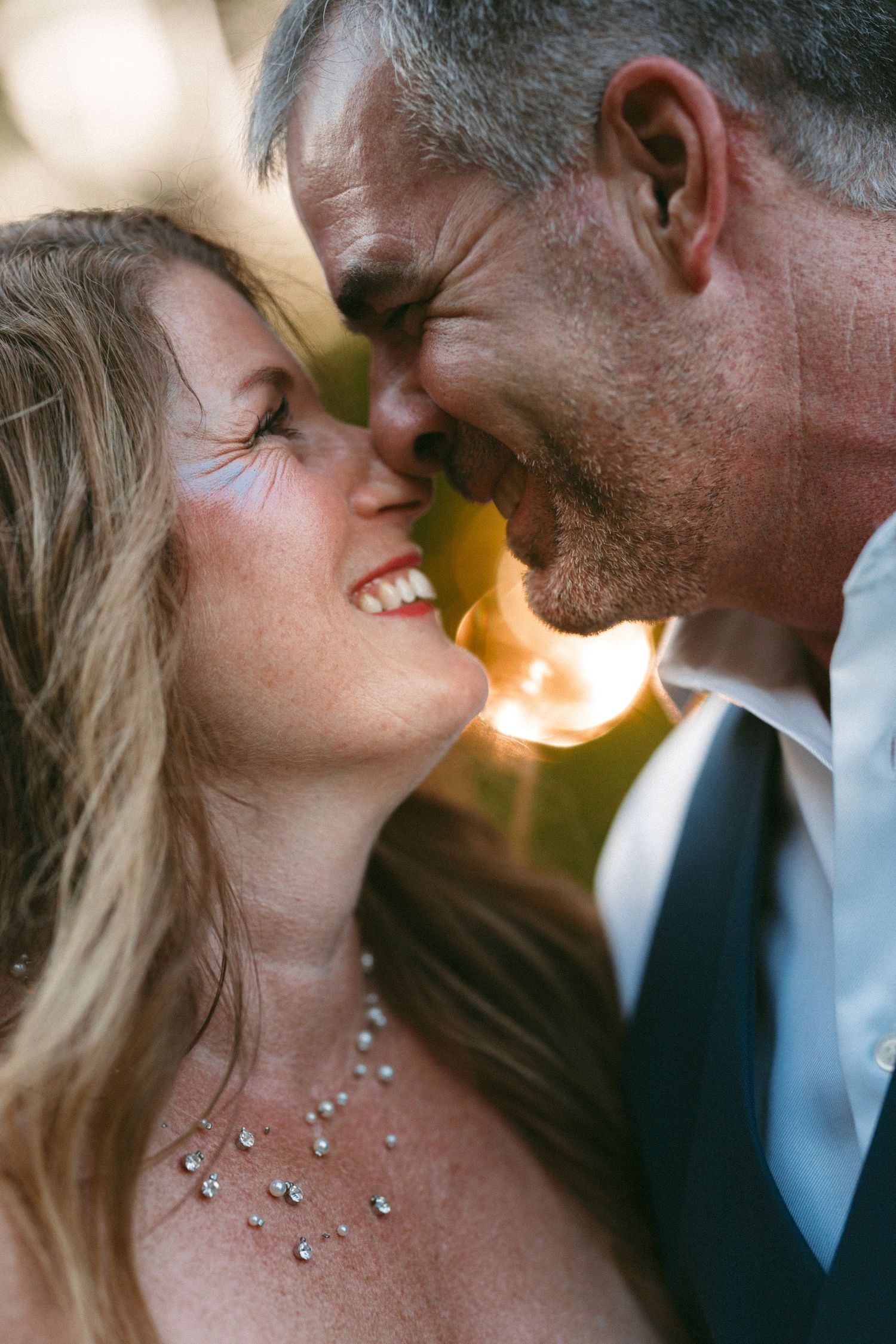 Intimate close-up sequence of couple sharing romantic moments at sunset.