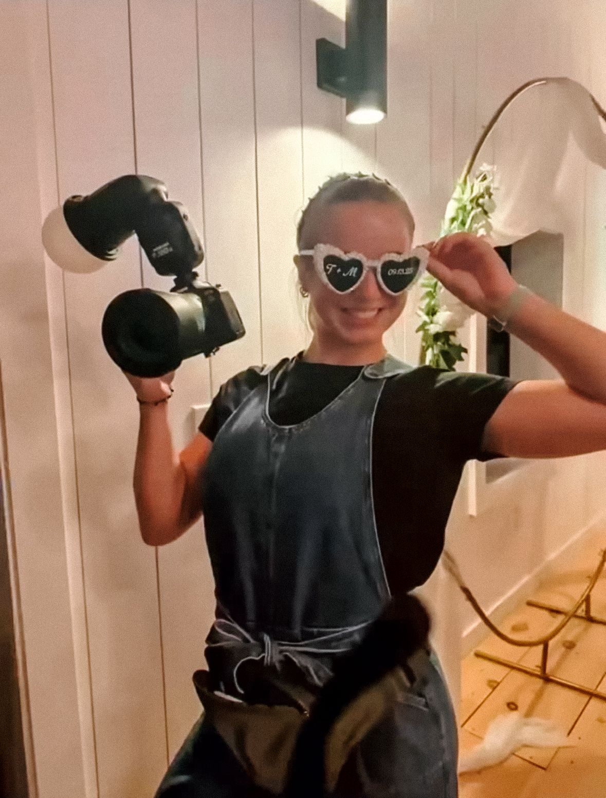 Person in dark clothing demonstrating VR headset movements indoors.