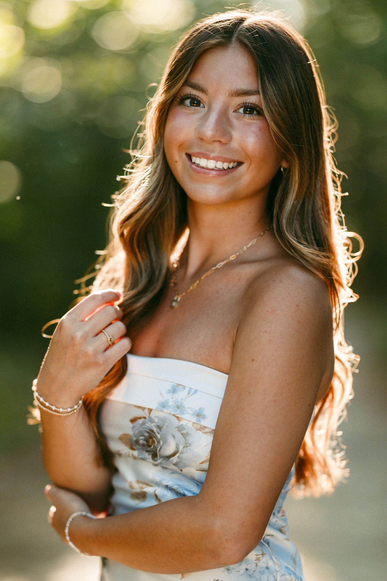 Portrait series in golden sunlight showing person in white top with natural bokeh background.