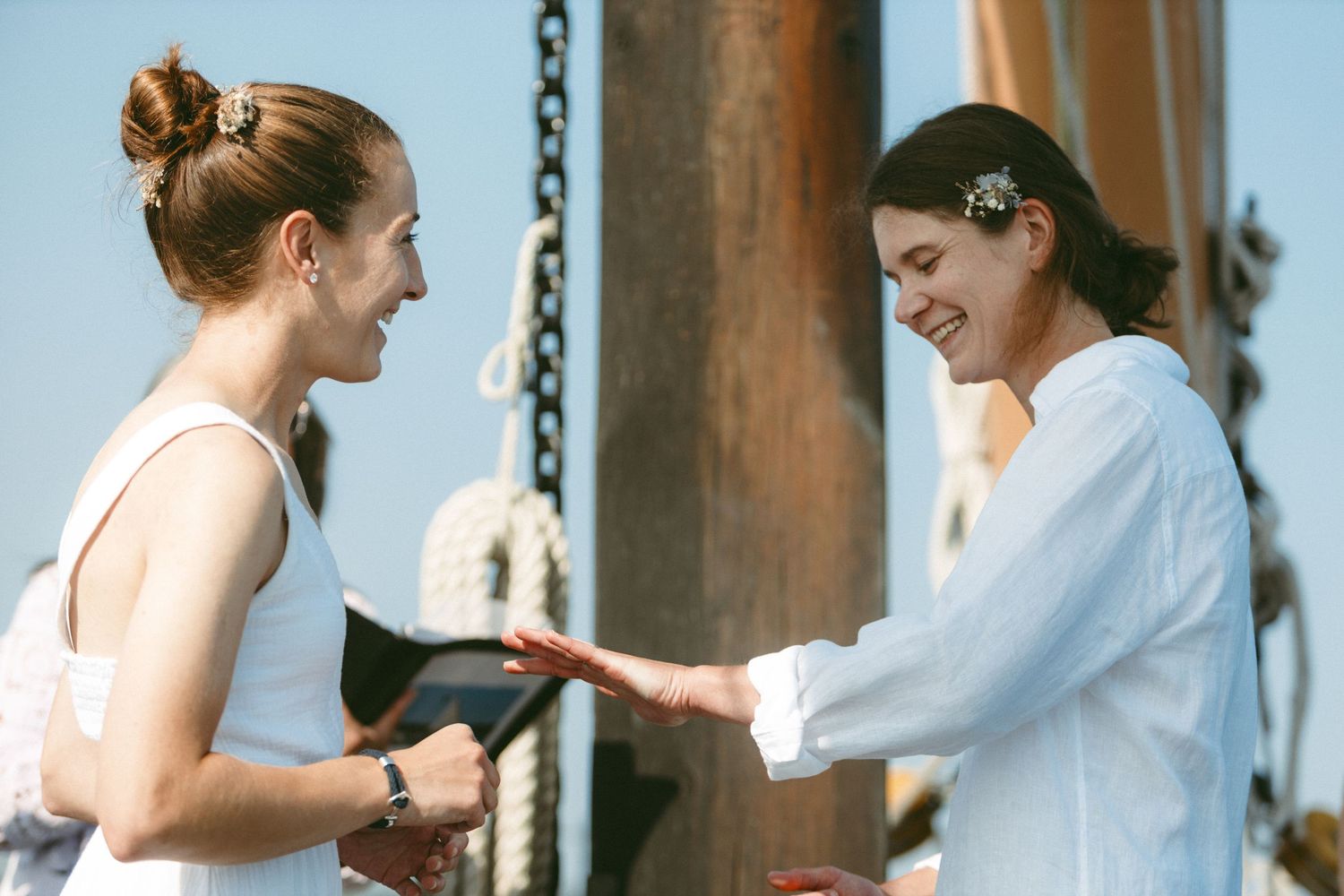 Candid moments captured during a waterfront celebration.