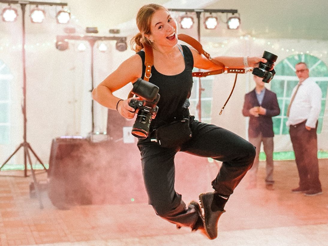 Dynamic dance performance captured on stage with atmospheric lighting and smoke effects.