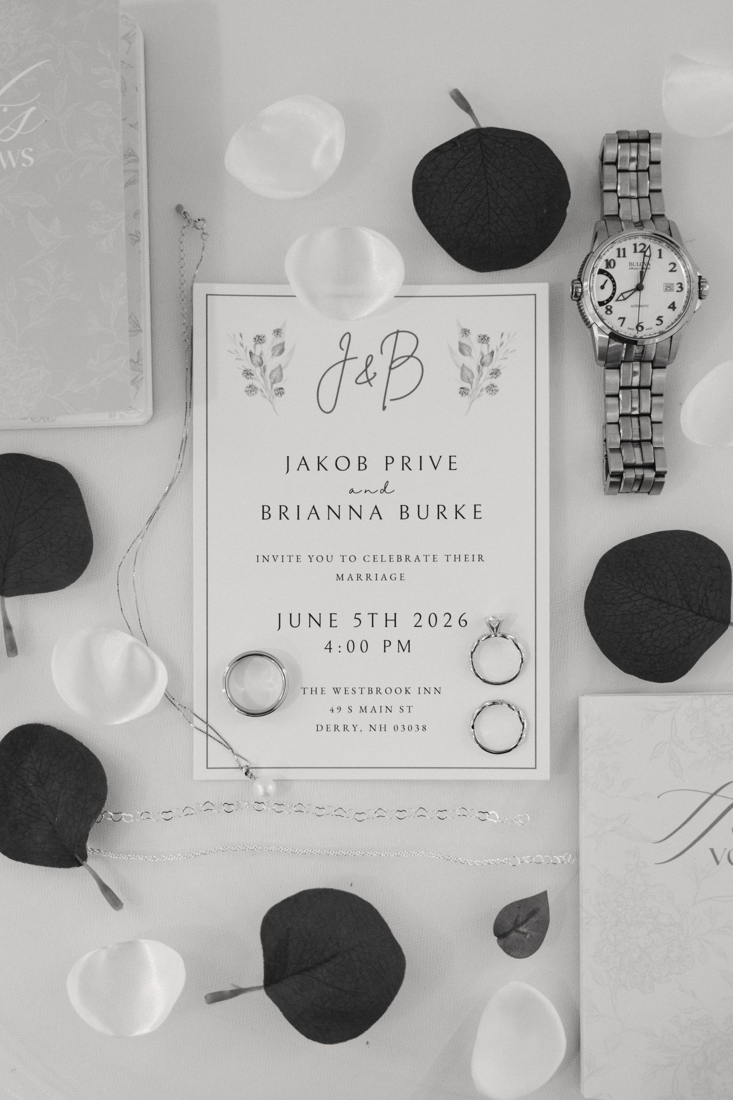 Black and white wedding invitation for Jakob Prive and Brianna Burke, June 5th 2026, with rings and watch.