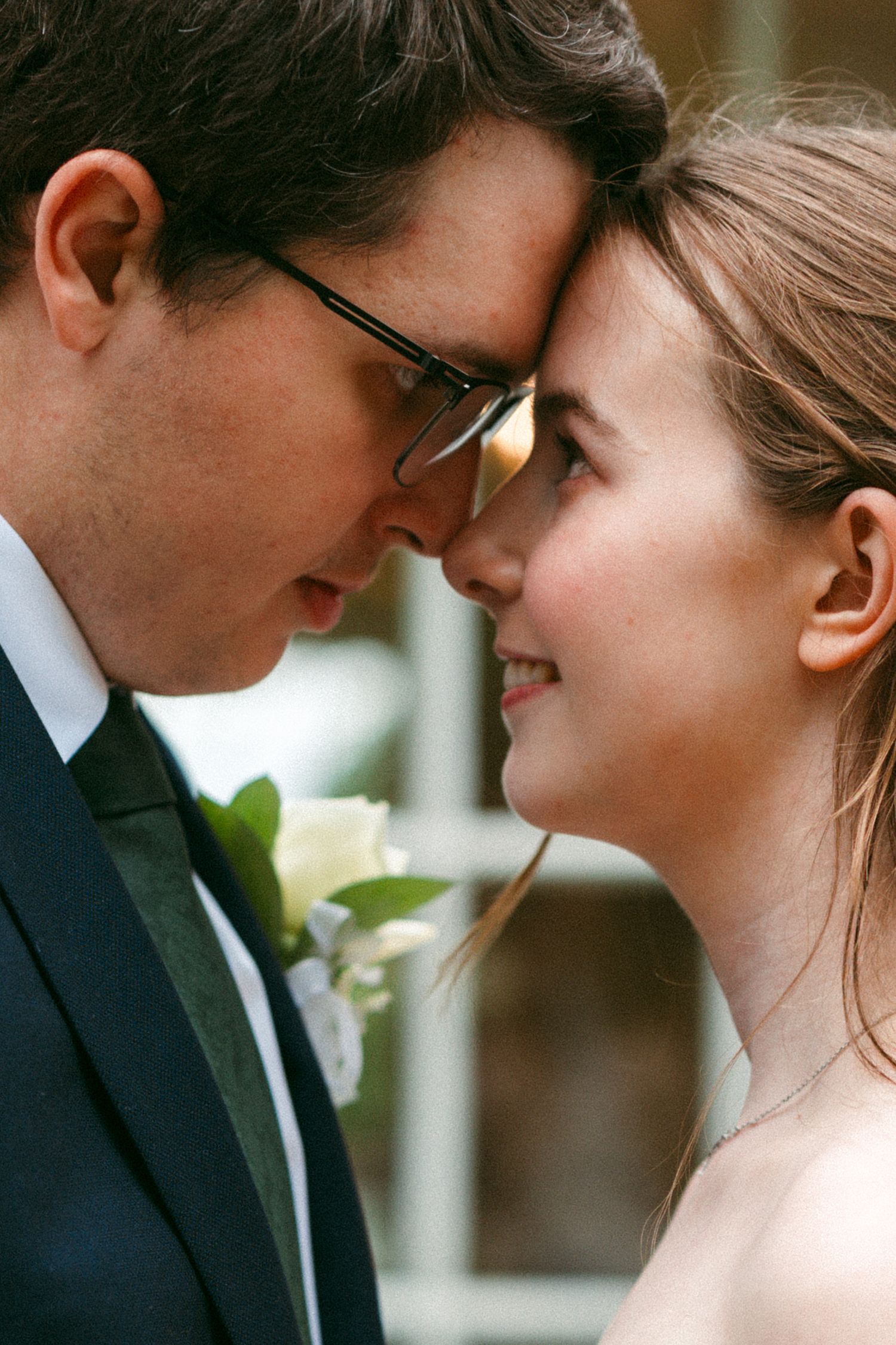 Close-up sequence of newlyweds sharing tender moments during their wedding celebration.