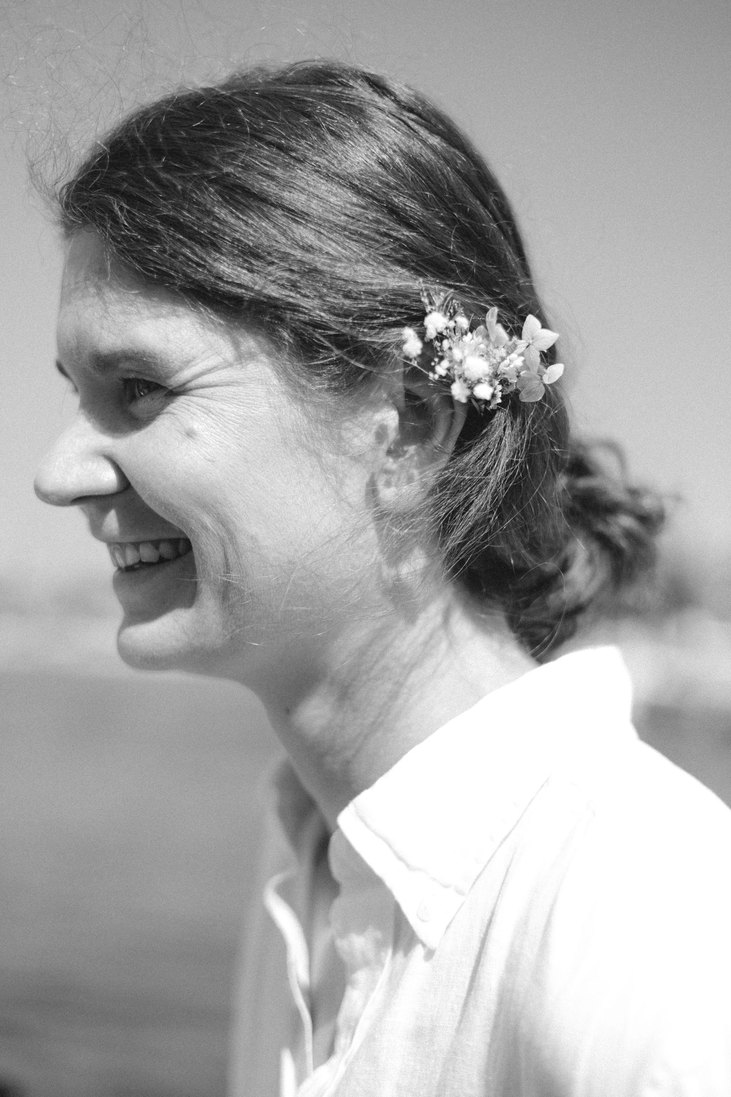 Black and white profile shots showing delicate floral hair accessories.