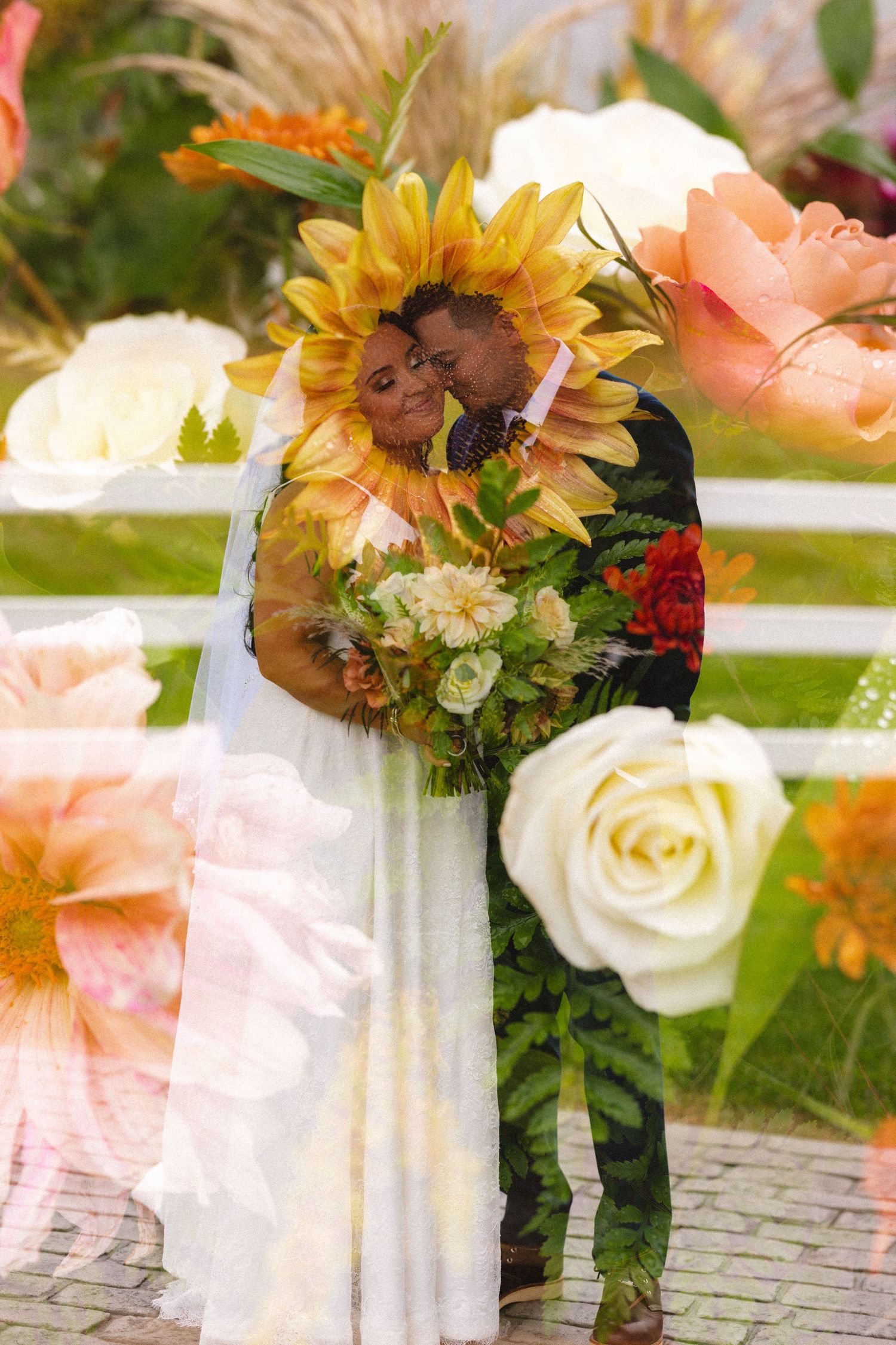 Beautiful floral arrangements with sunflowers and roses decorating white garden chairs.