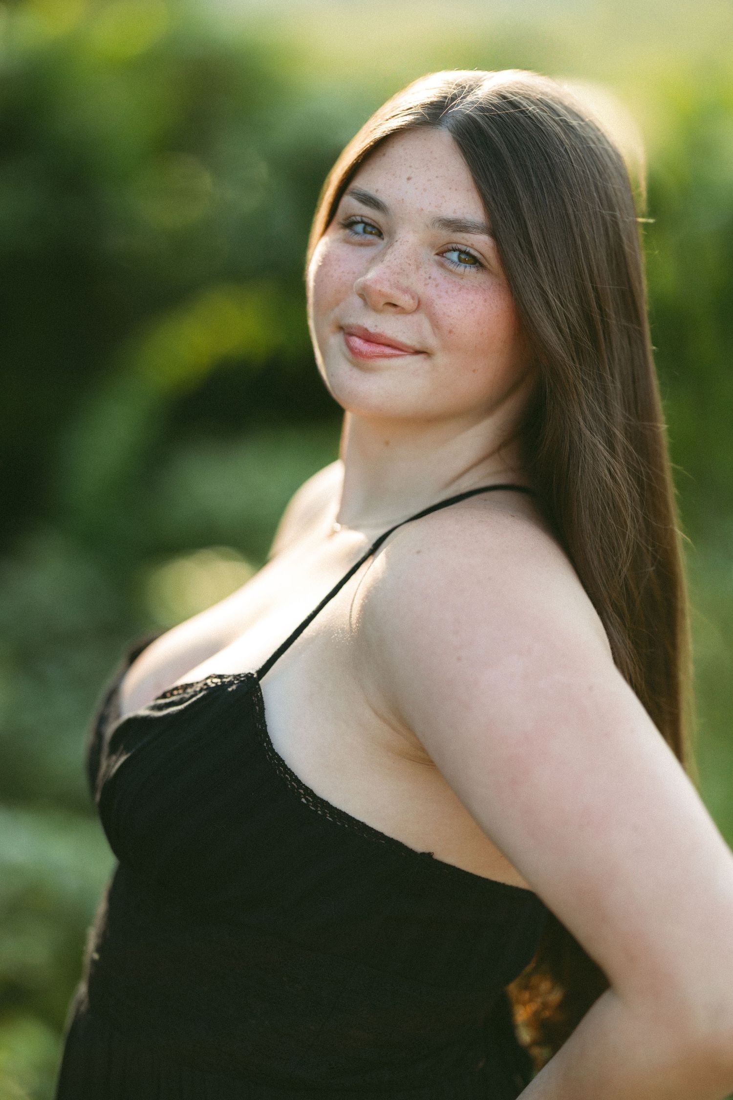 Summer portrait session in natural outdoor lighting.