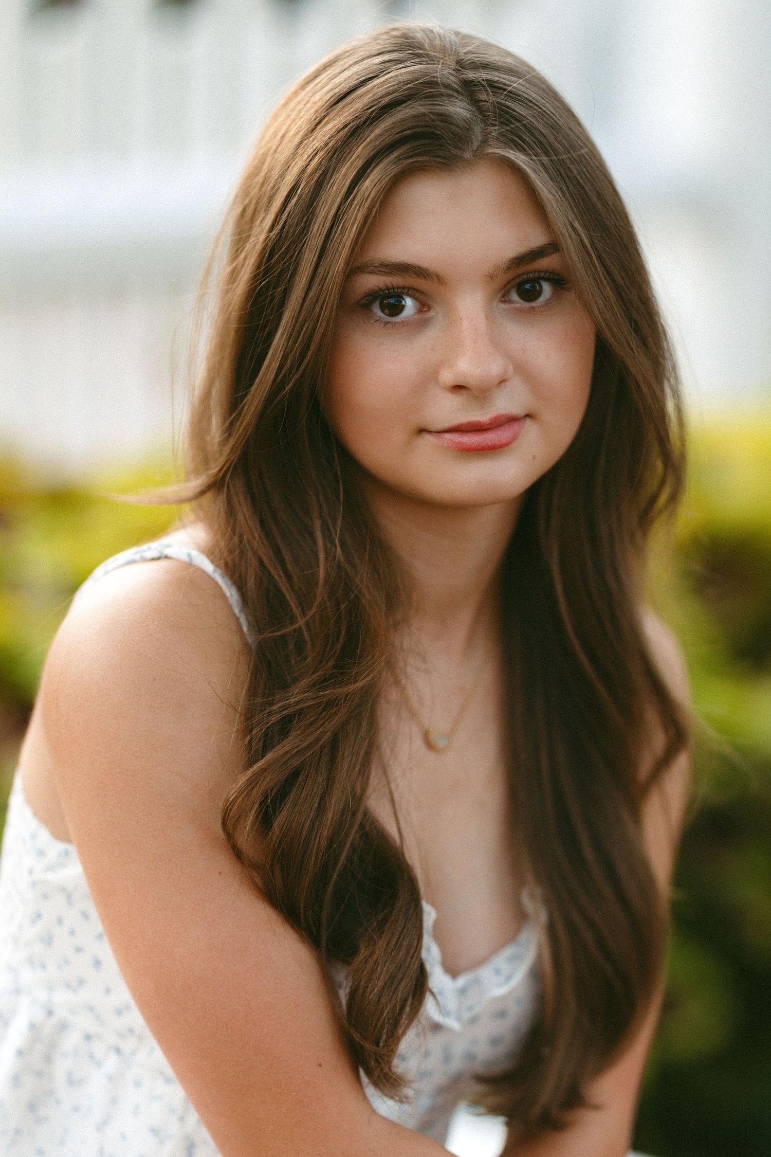 Elegant portrait series showing person in white lace dress against soft background.