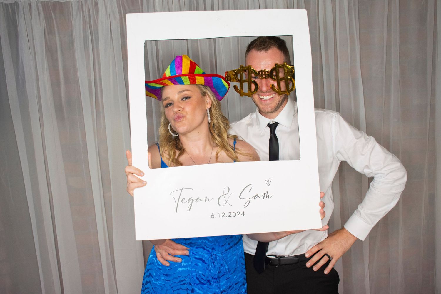 Photo booth fun by Stay&cee Creative, providing a unique and interactive way to celebrate your special day with personalized photo prints.