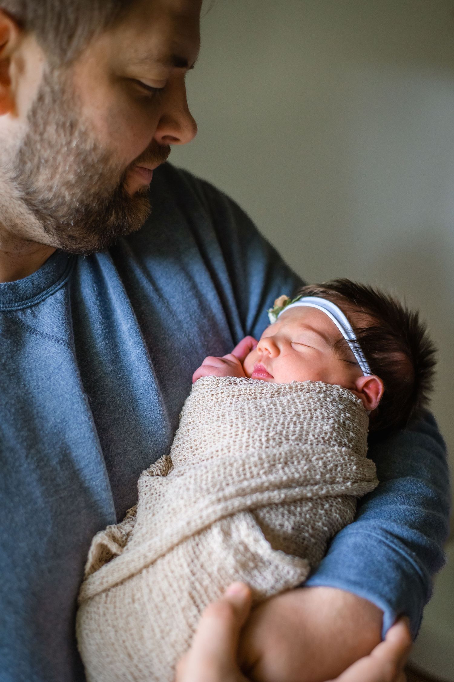 A gentle moment captured in natural window light shows caring and connection.