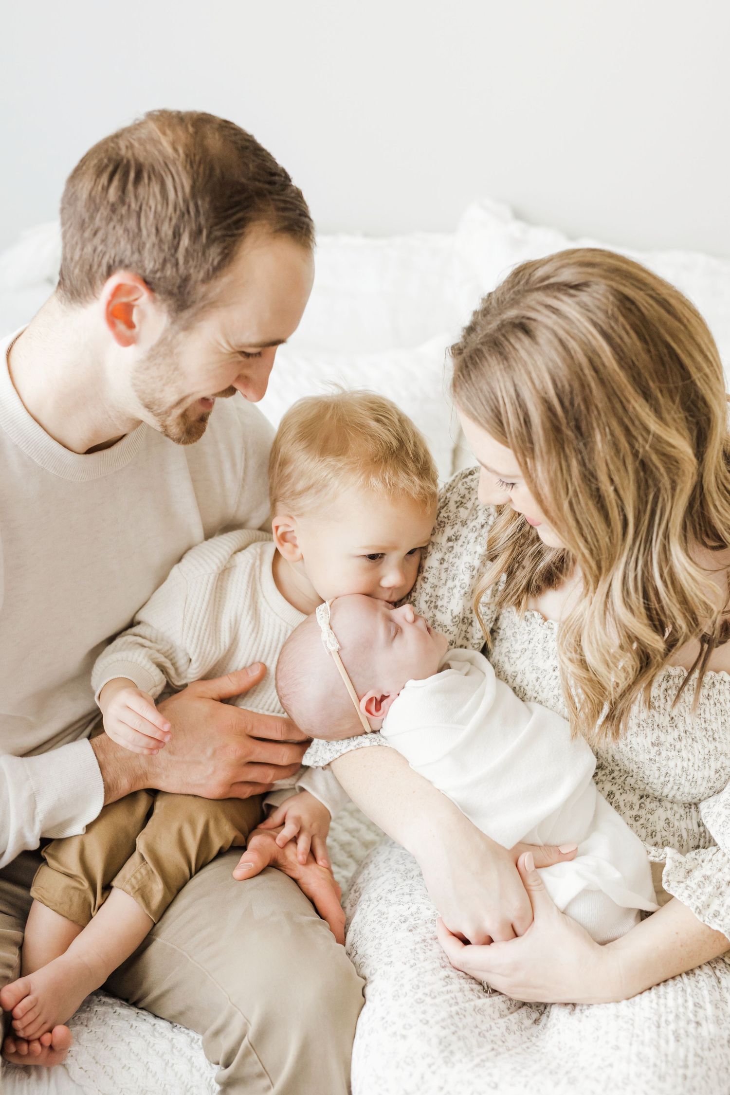 Wichita KS Newborn Photography big brother kissing newborn sister family photo
