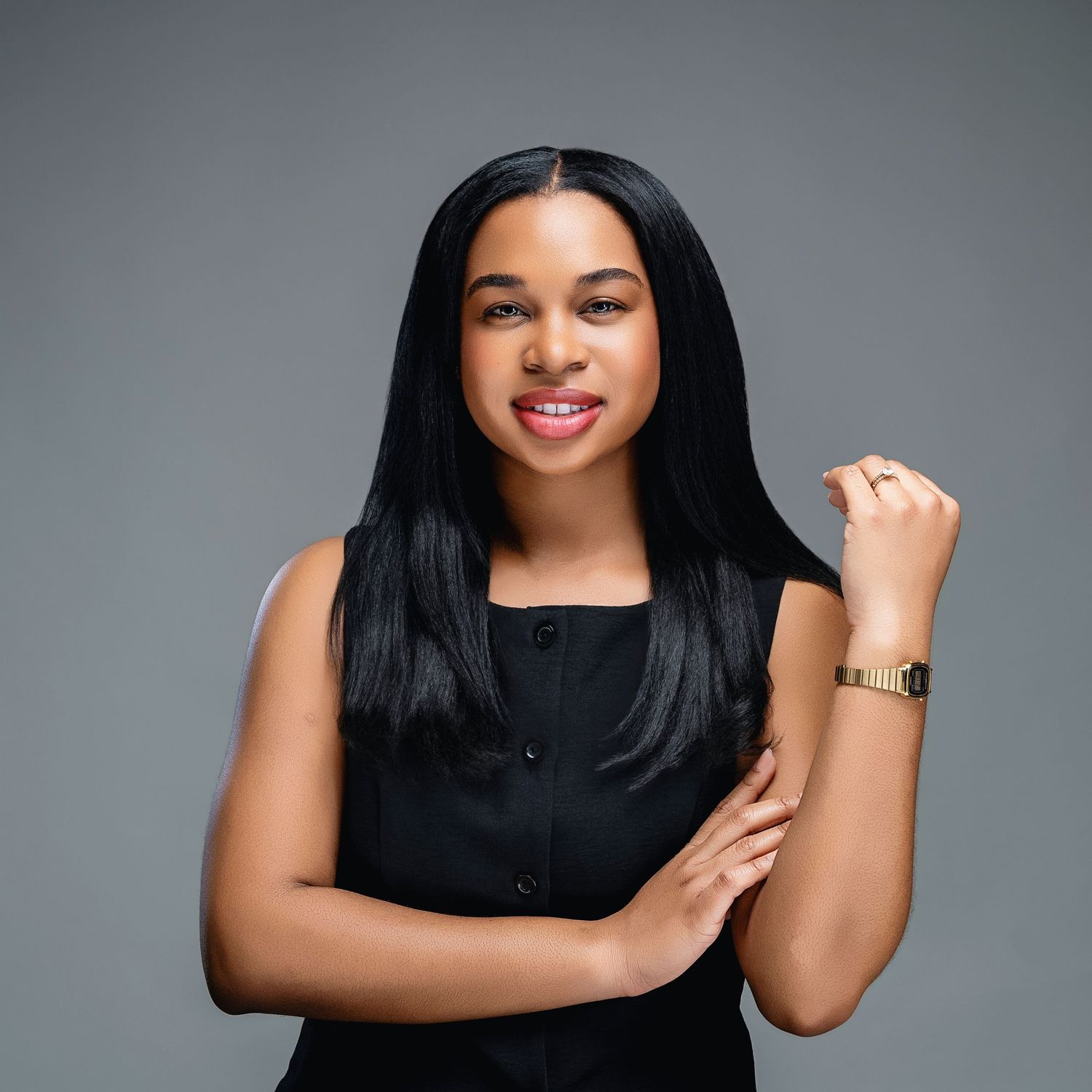 Professional portrait of someone in a sleeveless black top posing against a gray backdrop in various poses.