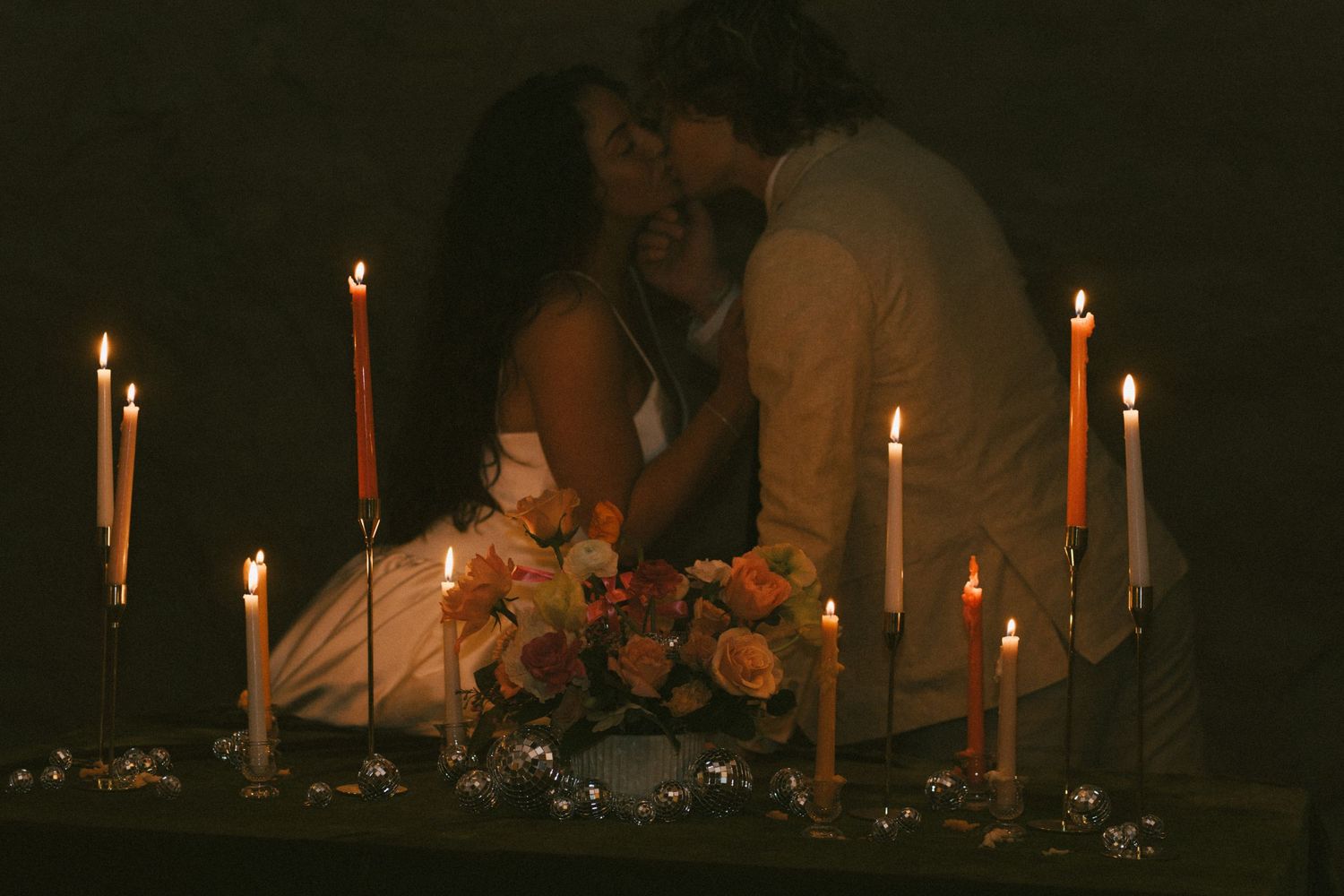 Candlelit reception setting with warm glowing ambiance.