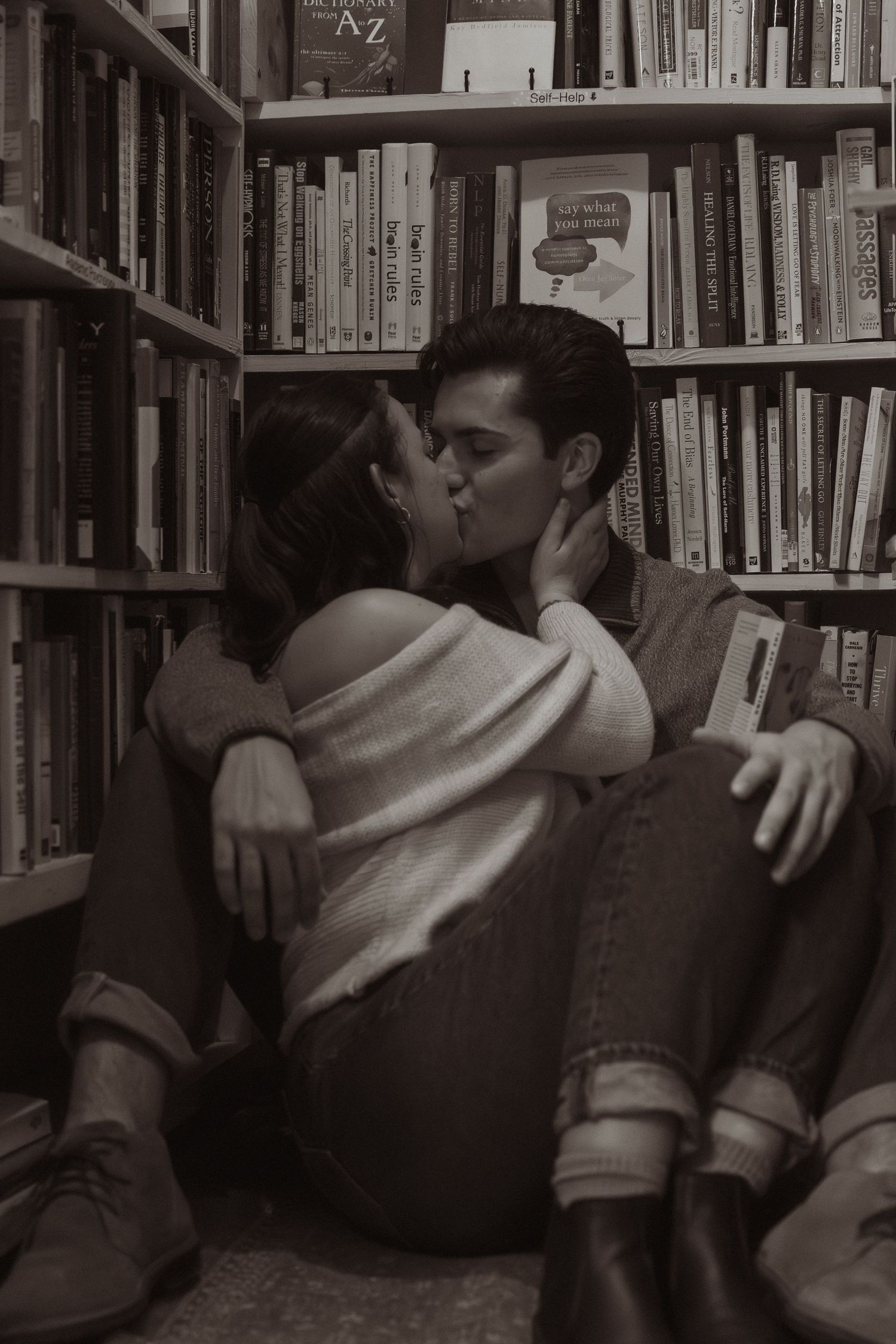A series of photos showing a person sitting among library bookshelves in different poses.