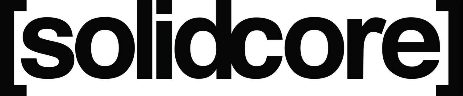 Black and white minimalist text logo for Solidcore fitness brand. Washington DC fitness