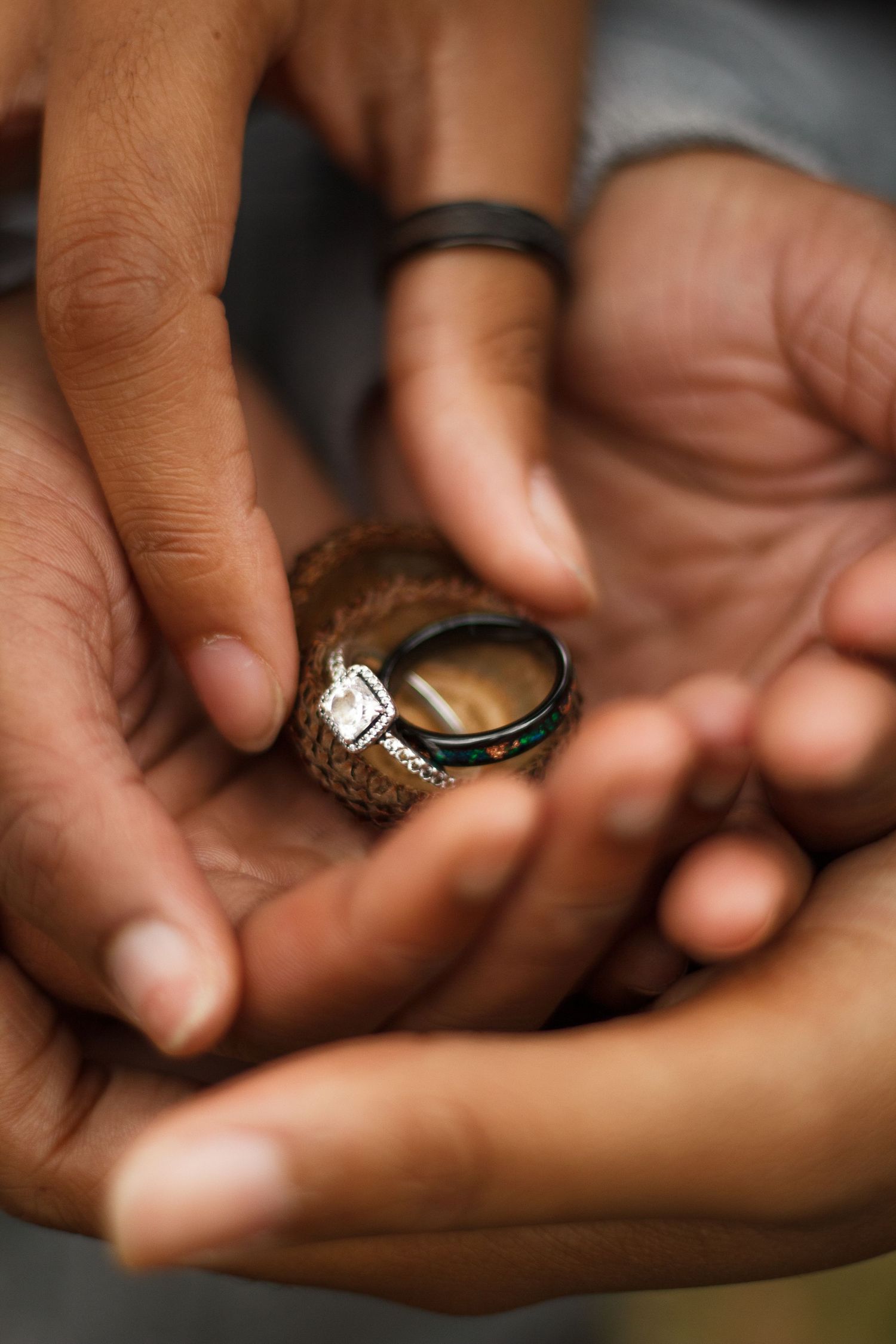 Couple holding rings for engagement session - LGBTQ+ friendly Chattanooga TN Photographer
