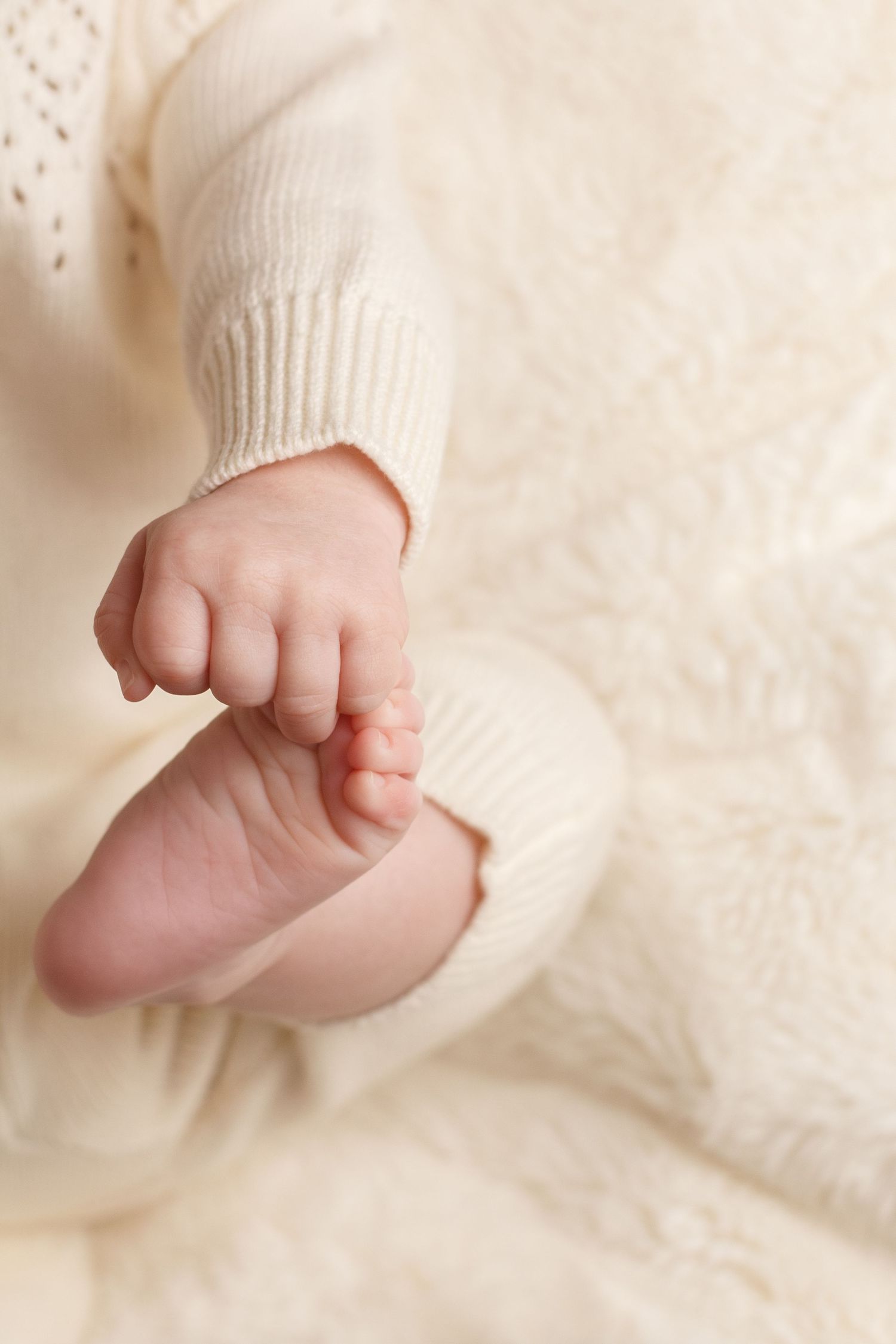 Close up detail of baby holding his toes during a Dalton Georgia Milestone Session