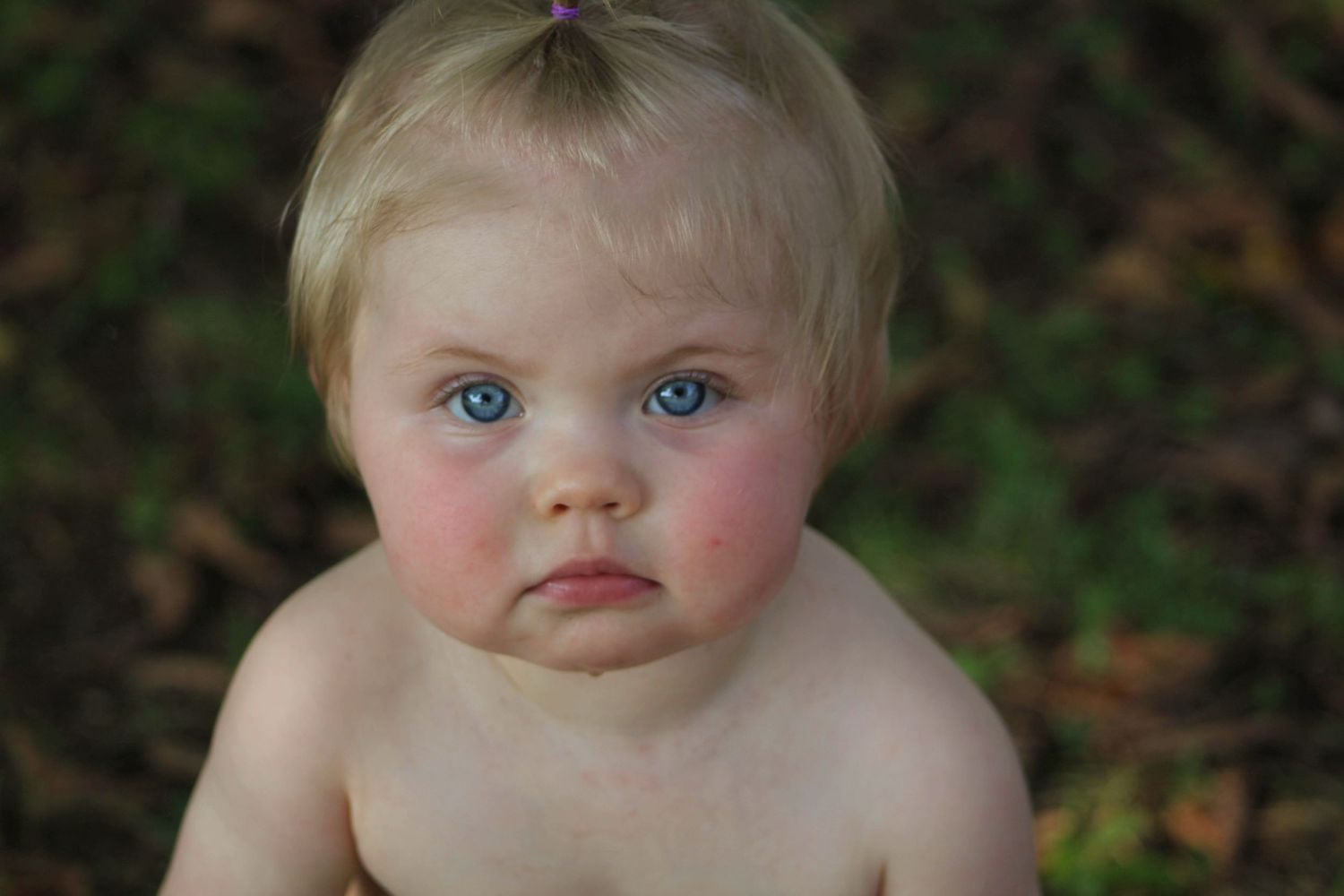 Close up of toddlers face during an outdoor cake smash session in  Tunnel Hill Georgia