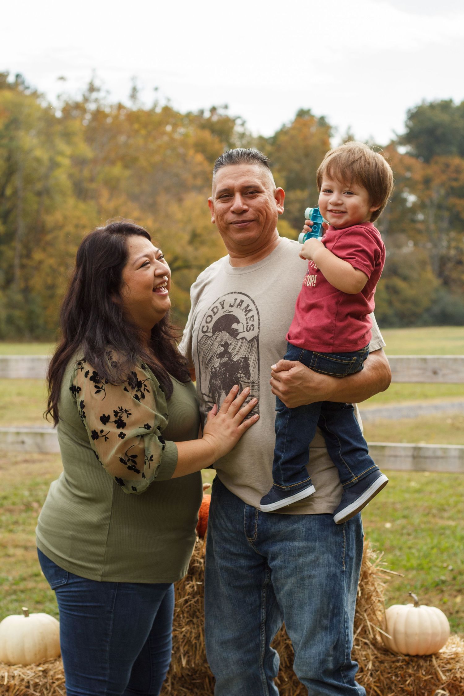 Fall family session with parents and toddler outdoors – family photographer Tunnel Hill GA.