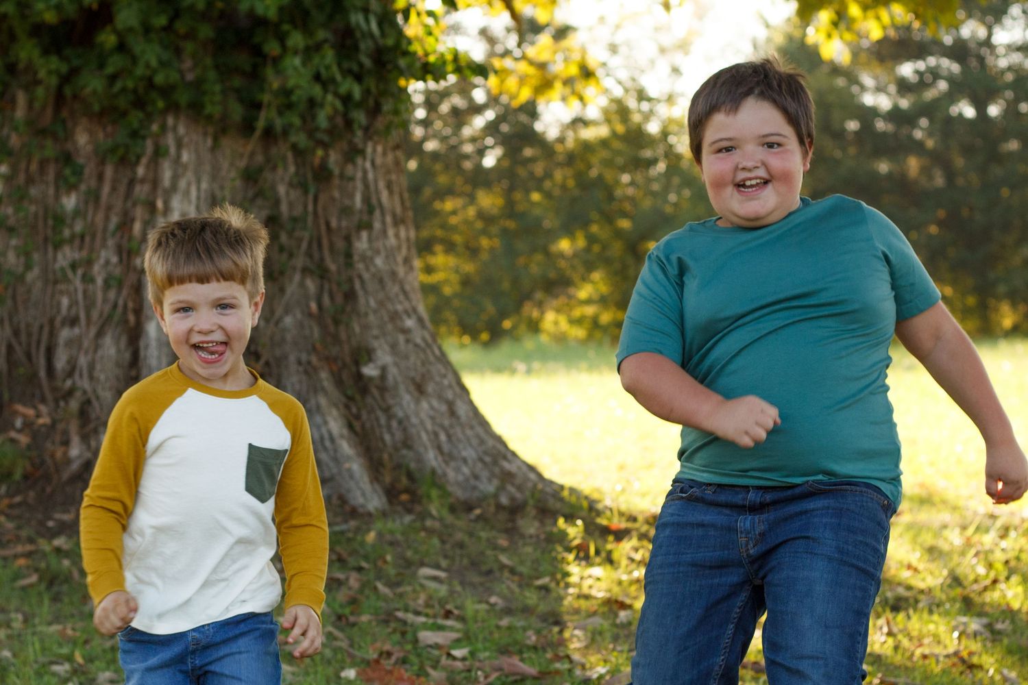 Two young boys smiling and playing during fall family session outdoors – North Georgia - Chattanooga child photographer