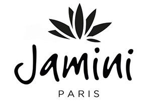 Jamini Paris brand logo featuring elegant black script font with a decorative lotus flower emblem above the text.