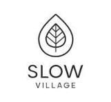 Slow Village logo featuring a minimalist leaf inside a water drop shape with elegant typography.