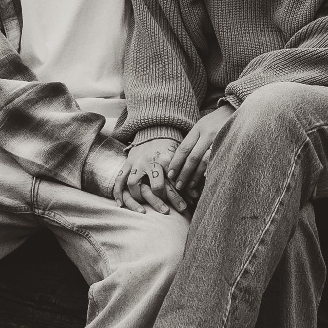 intimate couples photography session with couple sharing an intimate hand holding moment