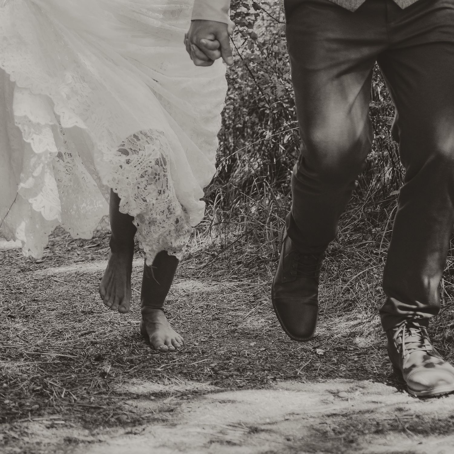 Close up black and white image of bride and groom embracing during intimate wedding in Coldstream bc