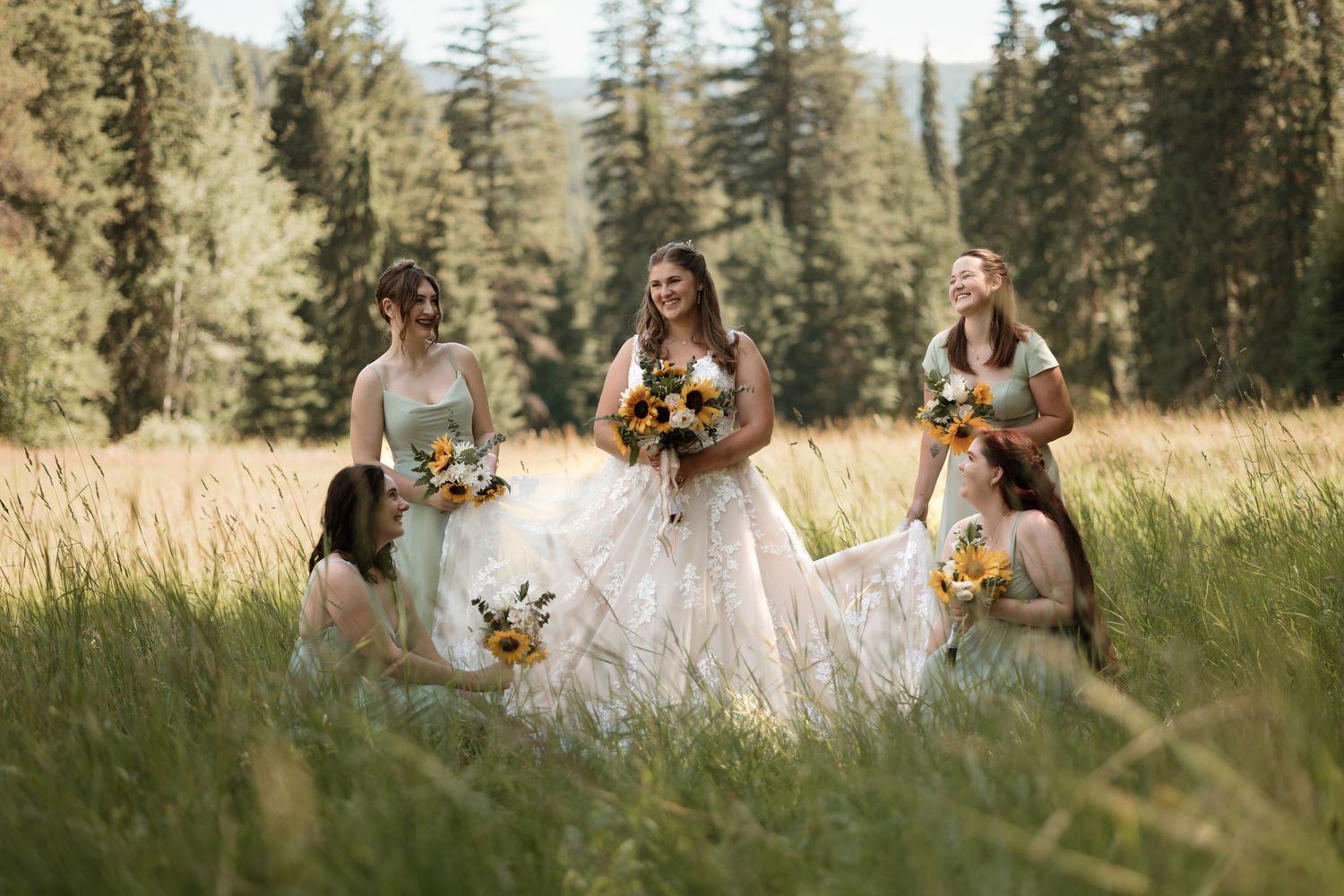 Bride with bridesmaids during forest wedding in kelowna bc