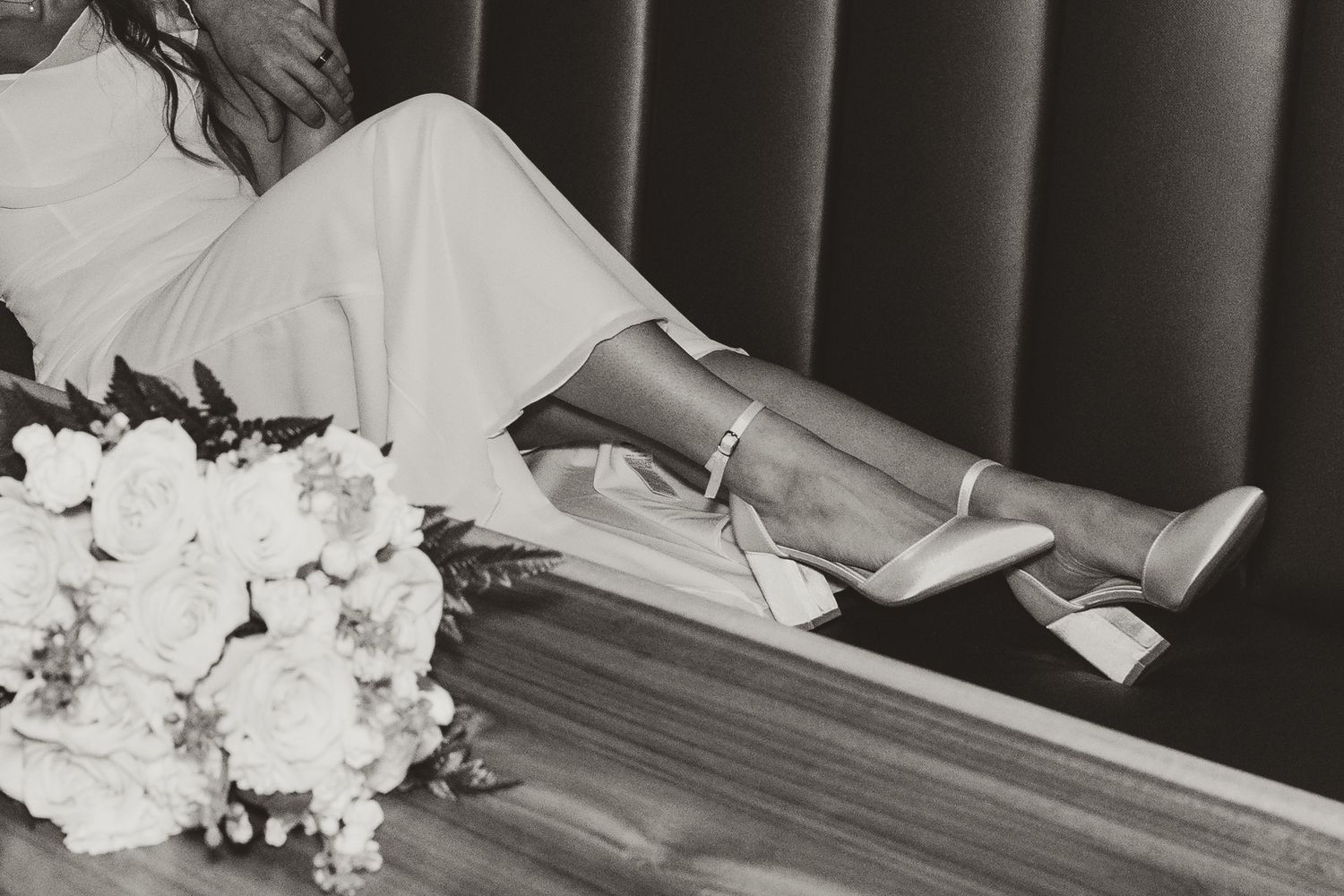 black and white detail editorial image of bouquet and wedding shoes during intimate west kelowna wedding elopement