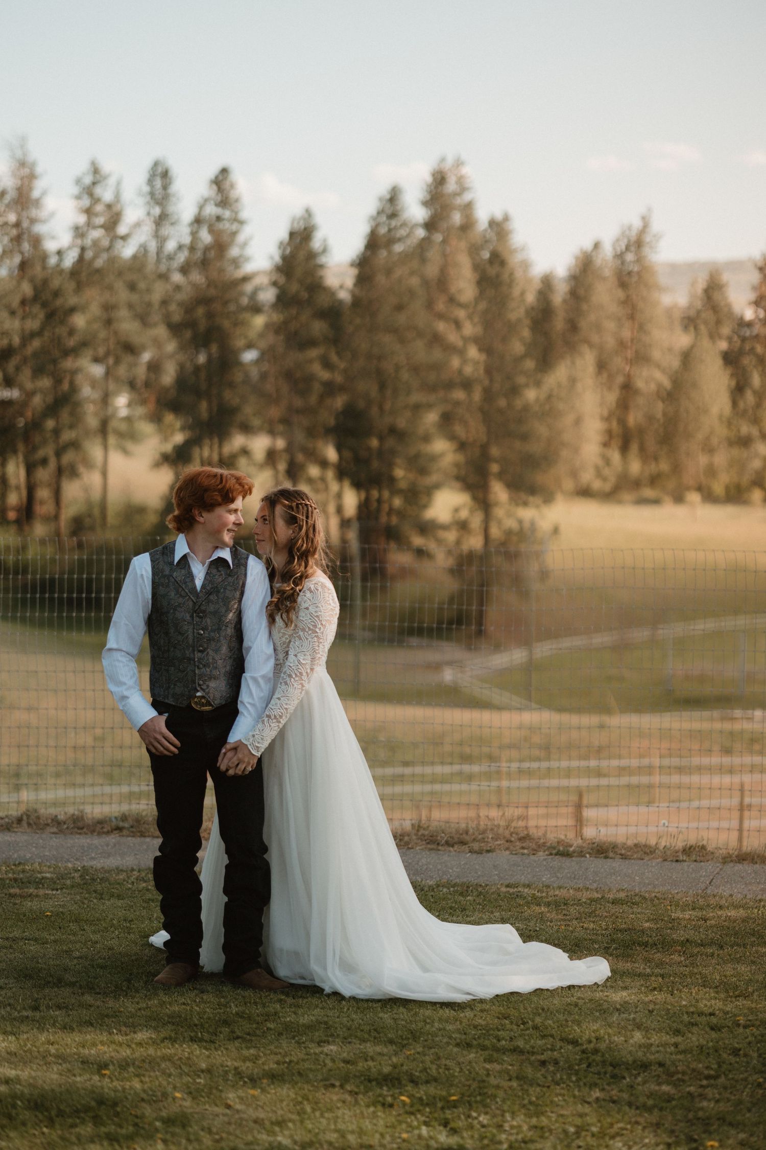 bride and groom portrait at a farm during sunset in spalumcheen bc
