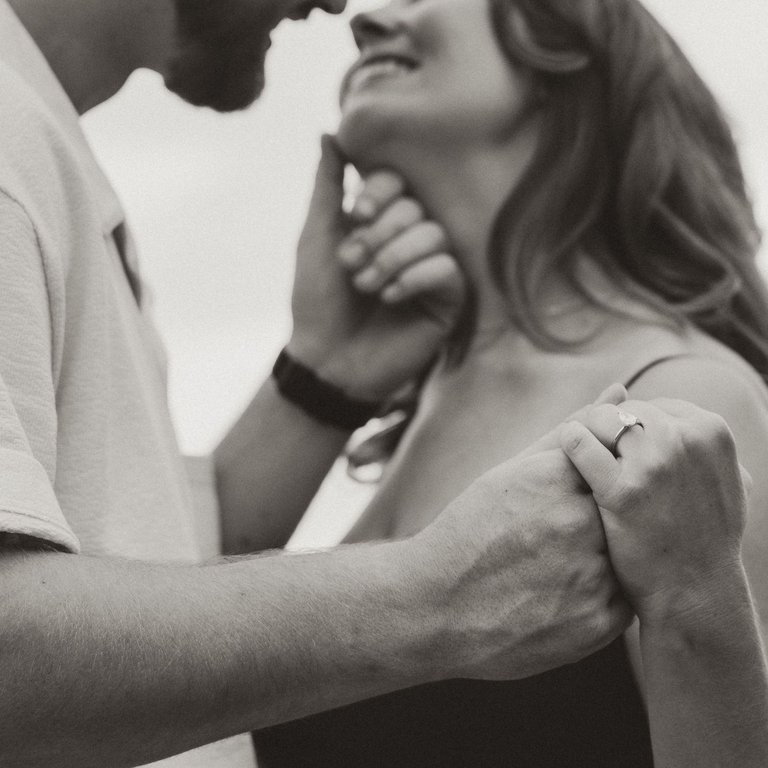 candid black and white image of engagement photography in kalamoir regional park bc