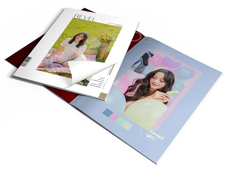 Two open photography magazines or portfolios displaying bright, colorful layouts on a white surface.