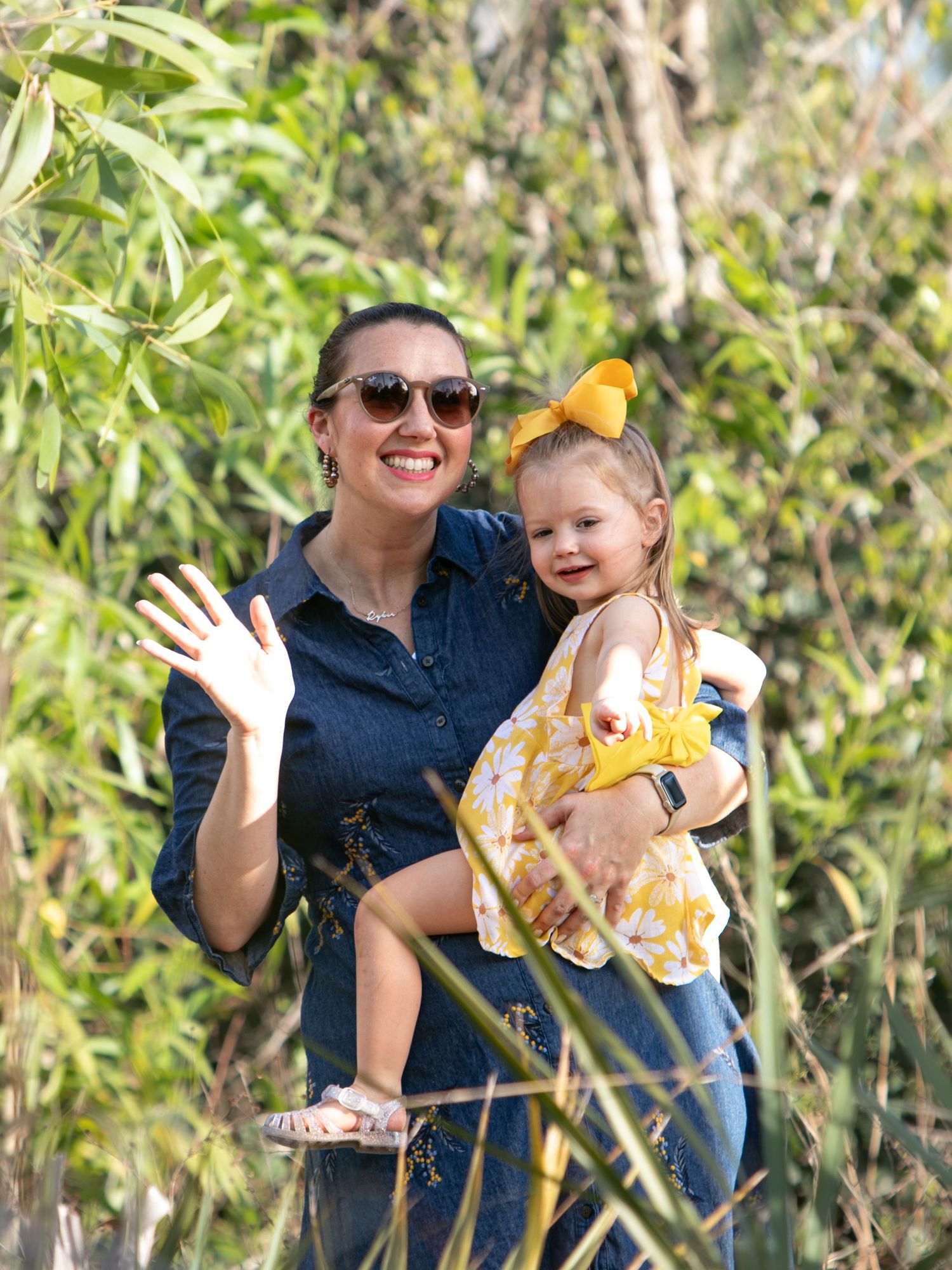 Three candid photos show joyful moments shared between parent and child outdoors among green bamboo stalks.