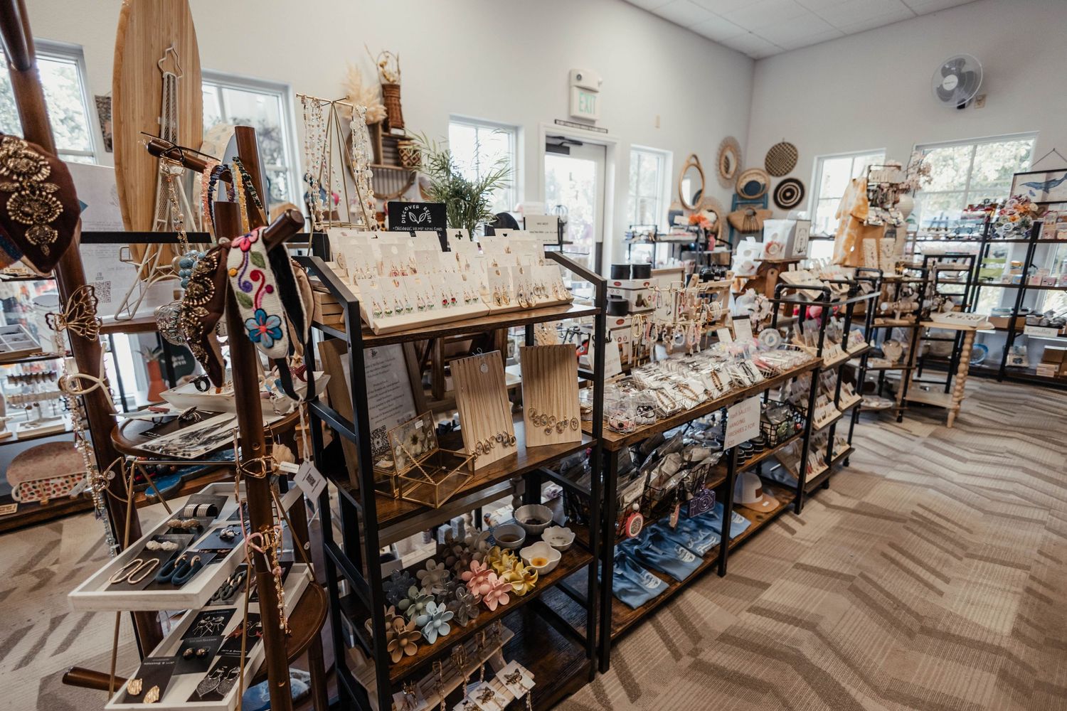Retail store interior showing multiple shelves of home decor and gift items.
