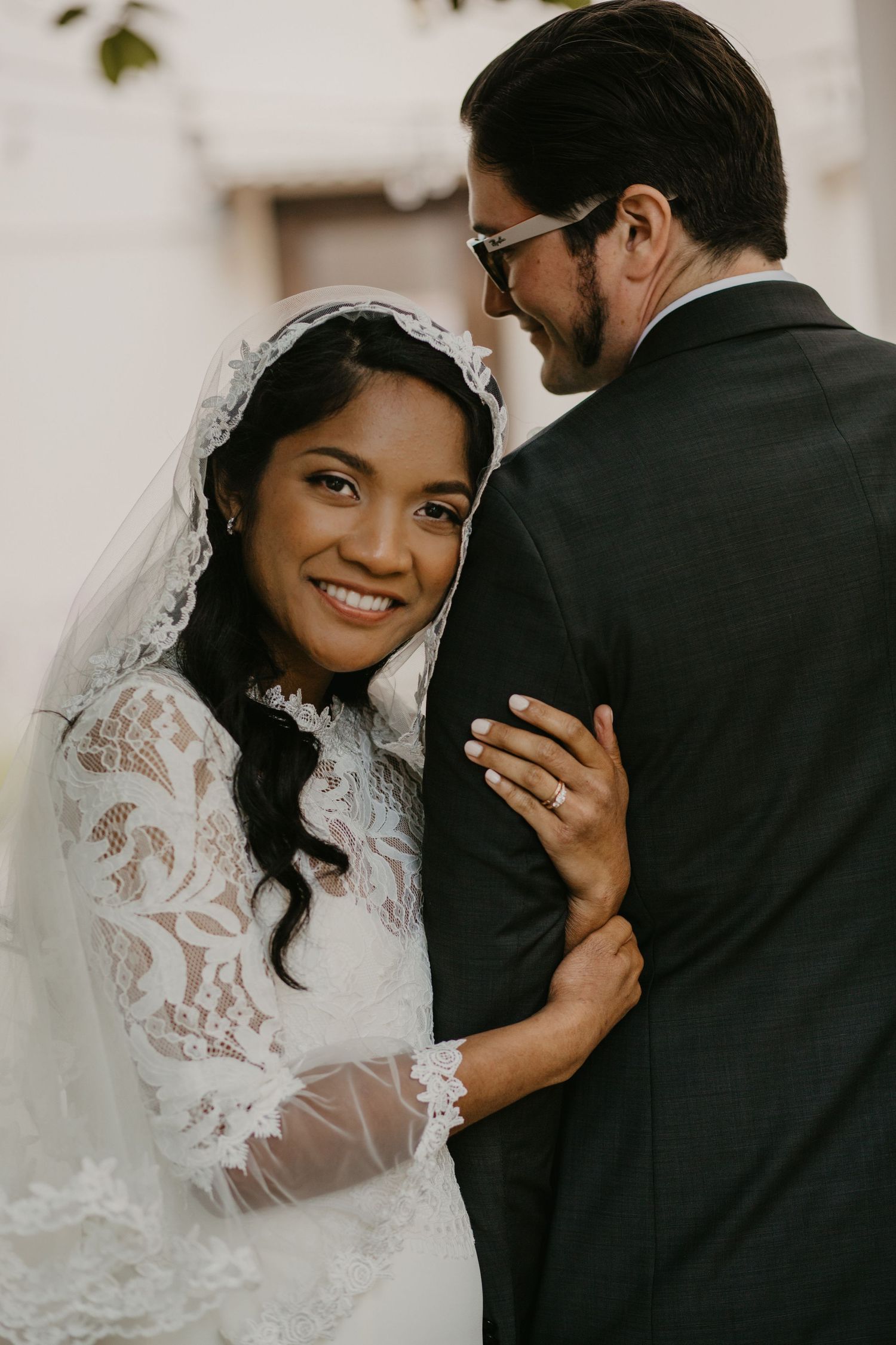 An intimate wedding portrait showing tender moments between newlyweds.