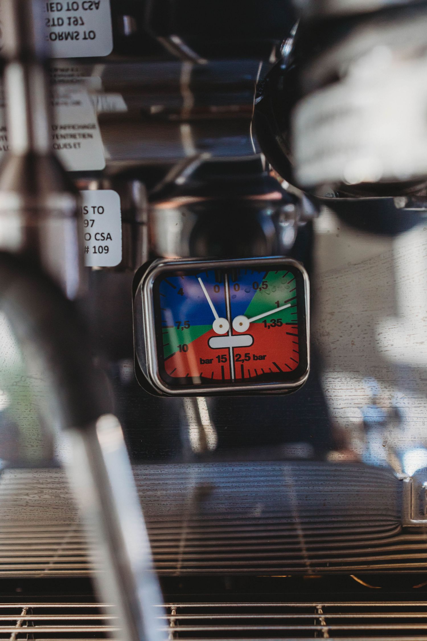 Digital display screen showing colorful graphics on coffee equipment.