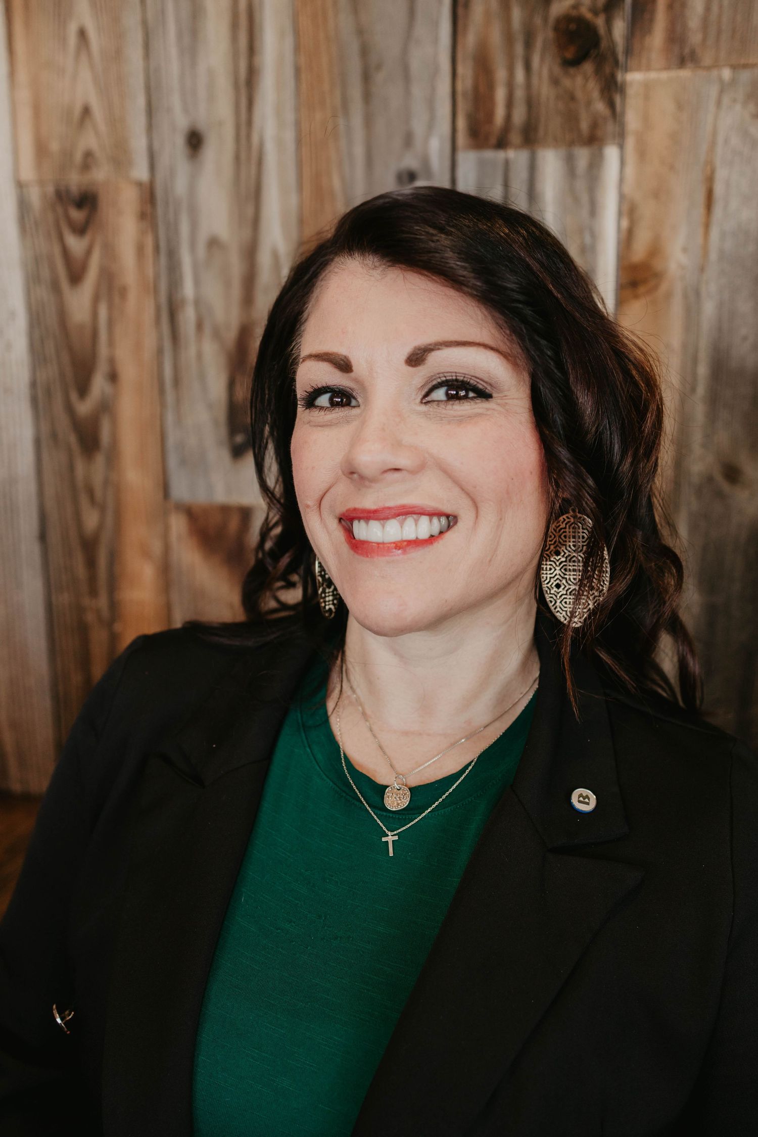 Professional portrait series showing joyful expressions against wooden background.