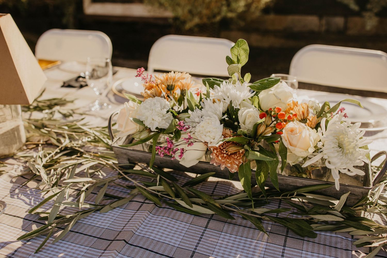 Elegant table setting with floral arrangements and place settings.