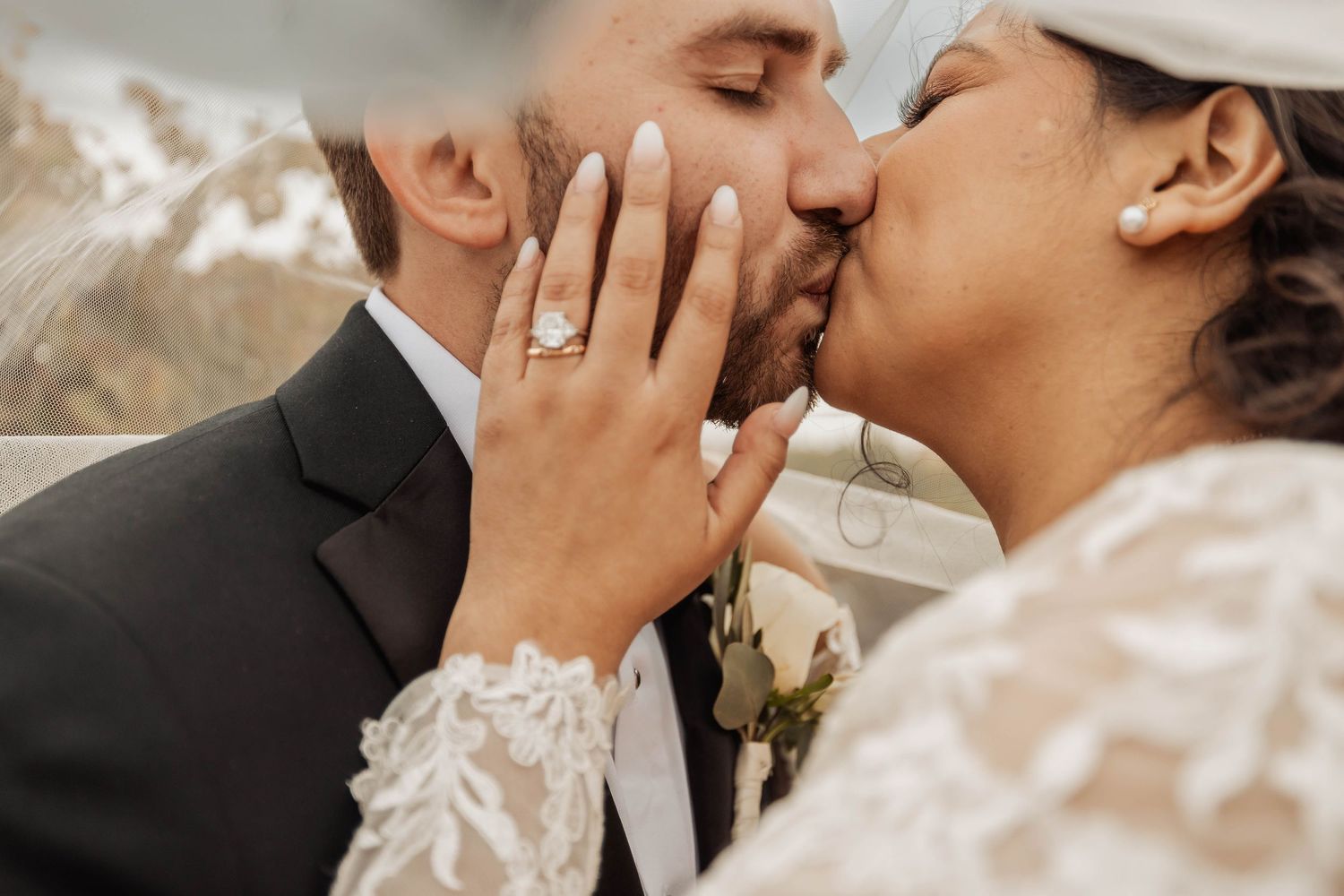 Romantic close-up of wedding couple sharing a tender moment.