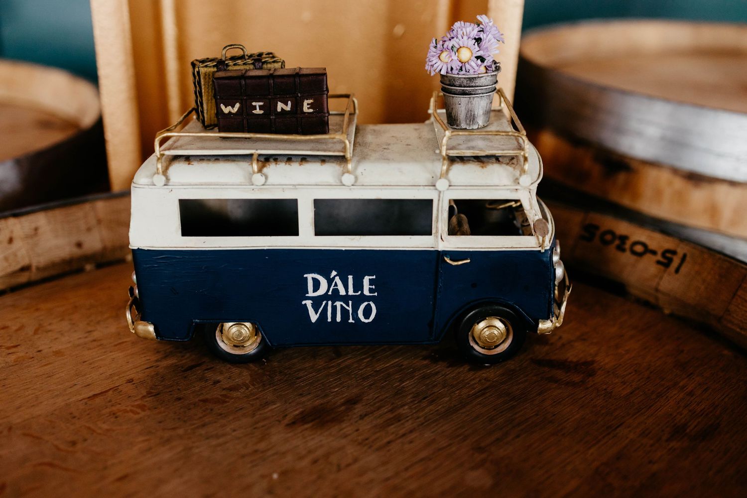 Wooden wine display case with Dale Vino branding on rustic surface.
