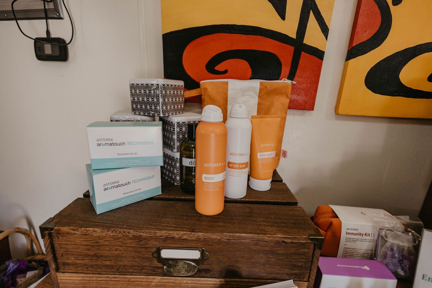 Rustic wooden storage area with orange wall decor and wellness products.
