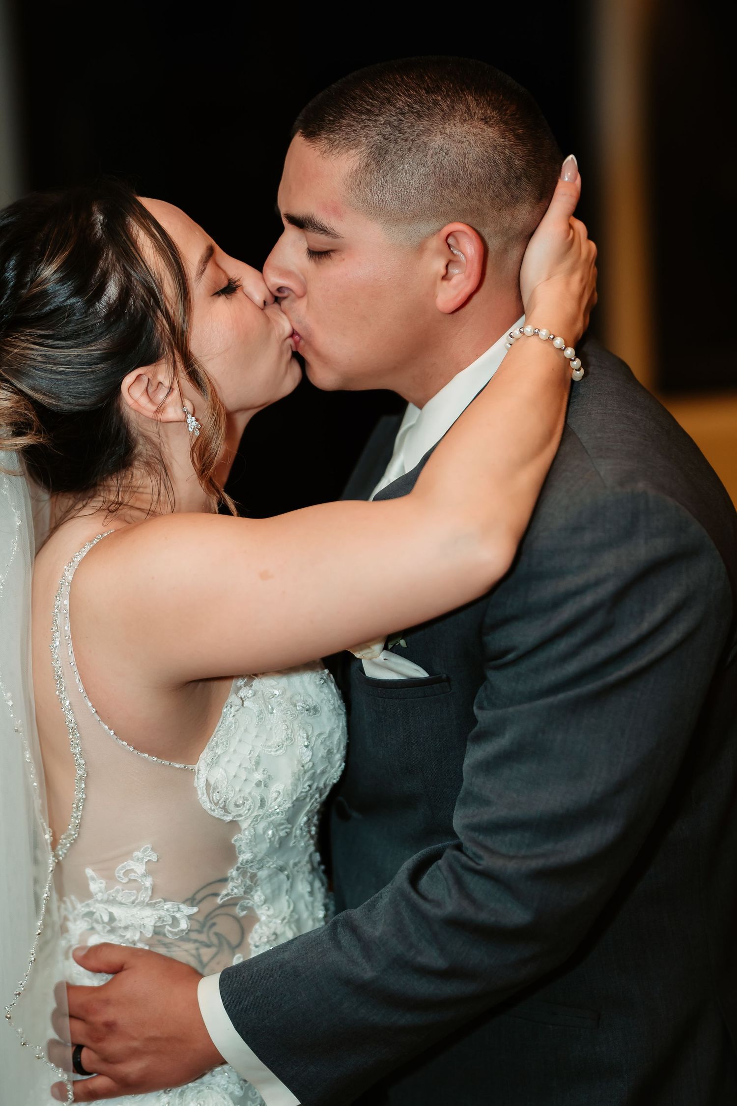 A romantic sequence of wedding photos showing the couple sharing their first kiss as newlyweds.