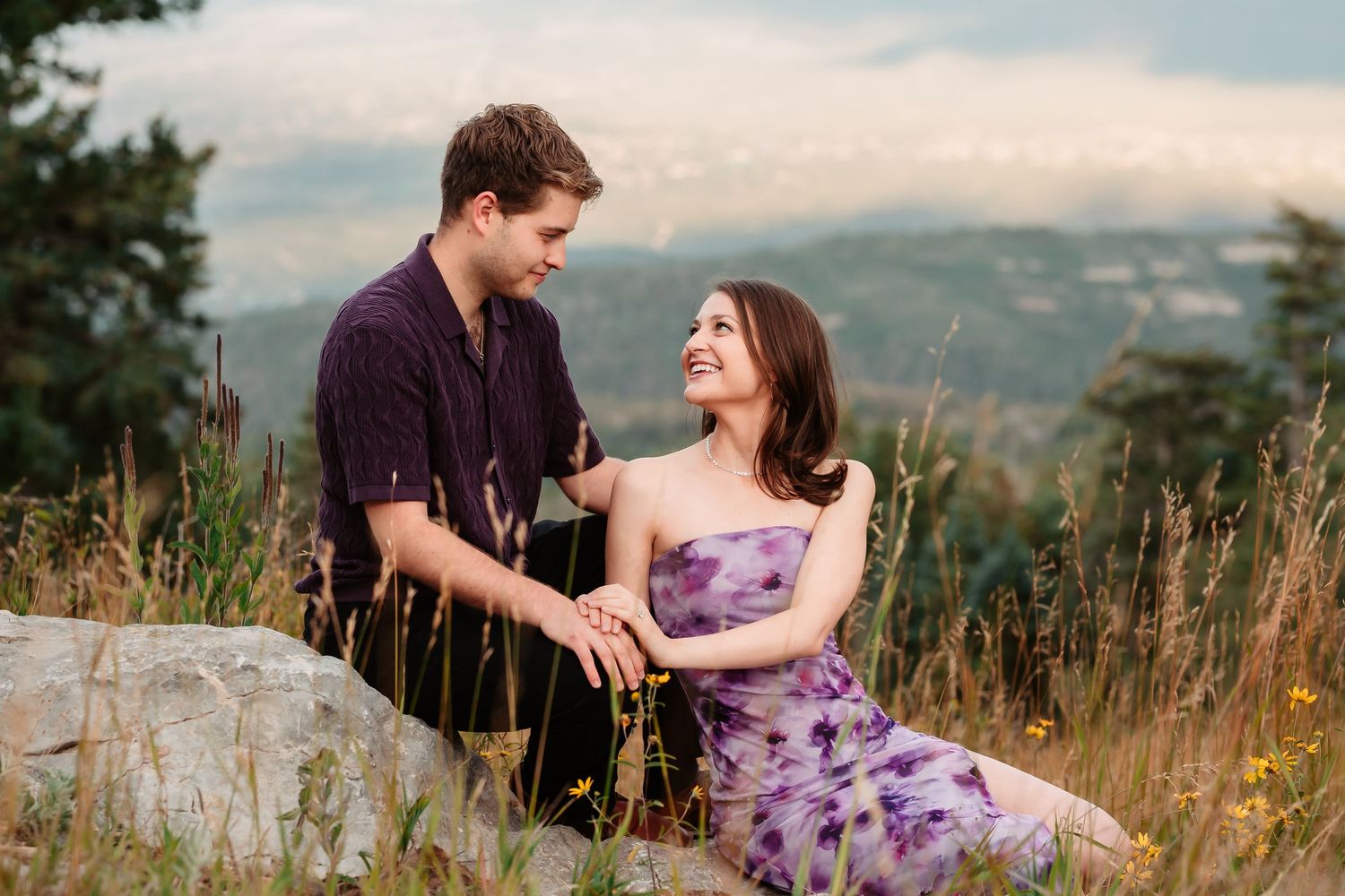An intimate photoshoot sequence in a scenic mountain landscape.